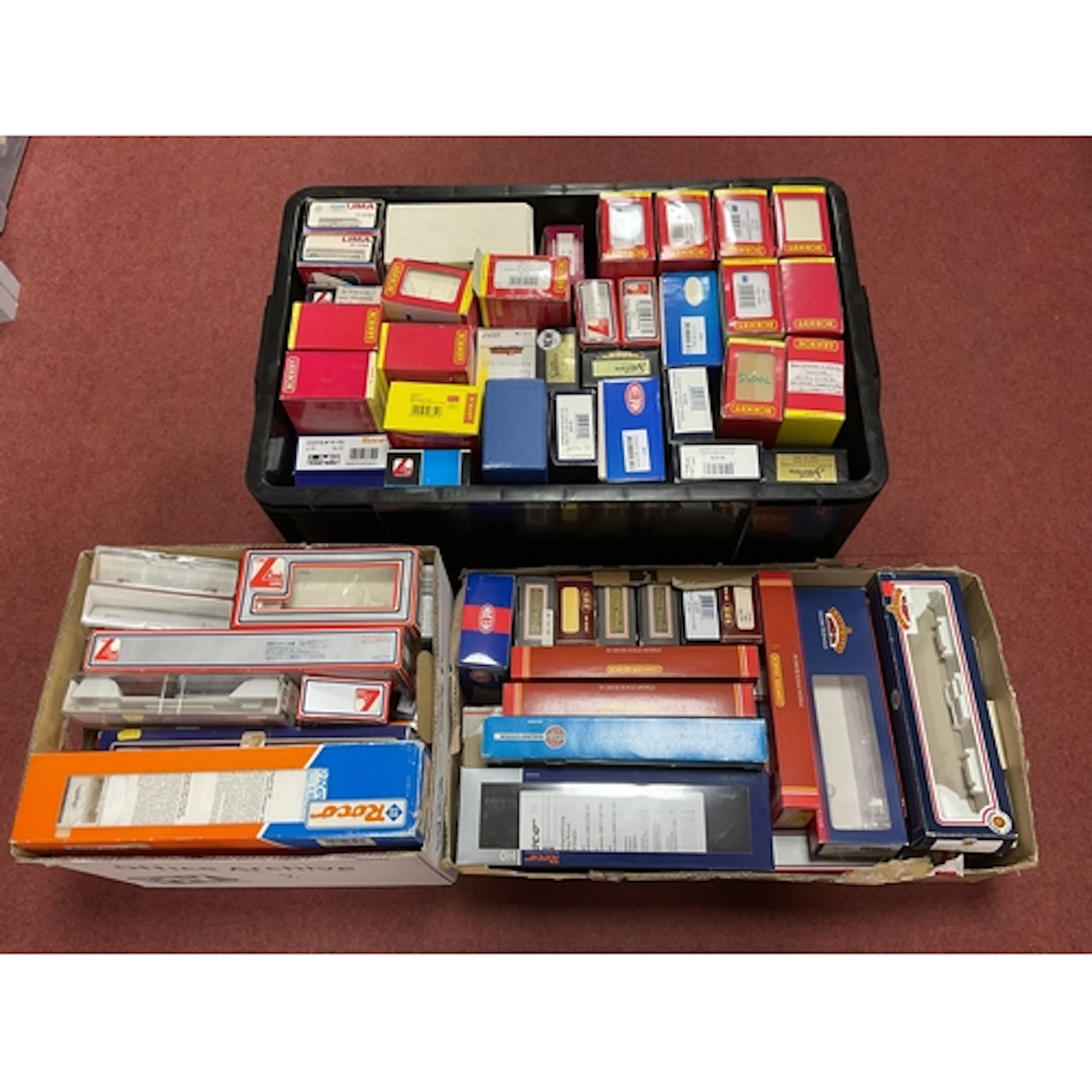 Three large containers of empty 00, HO and N gauge rolling s...