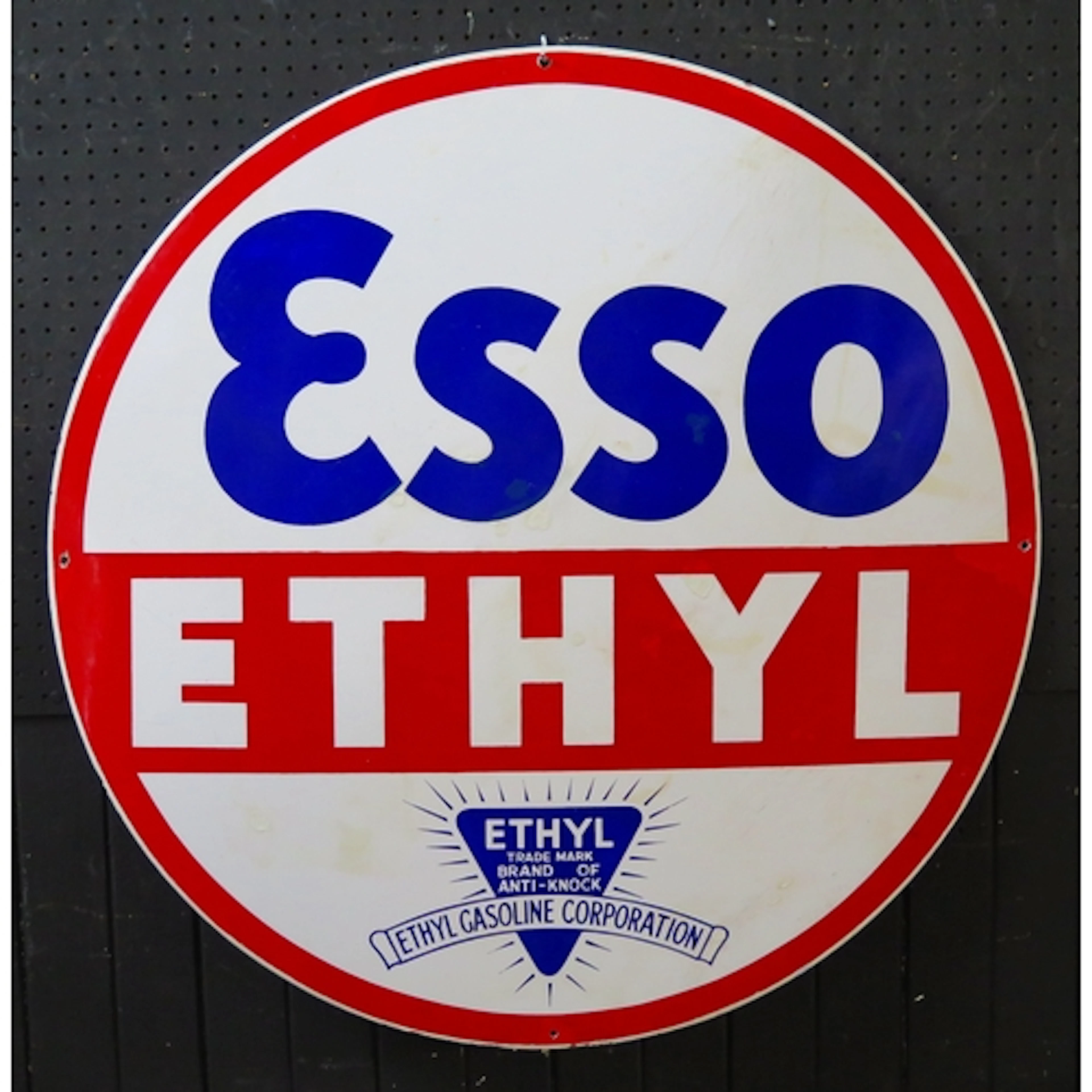 "Esso Ethyl" - an enamel circular advertising sign, 77cm dia...
