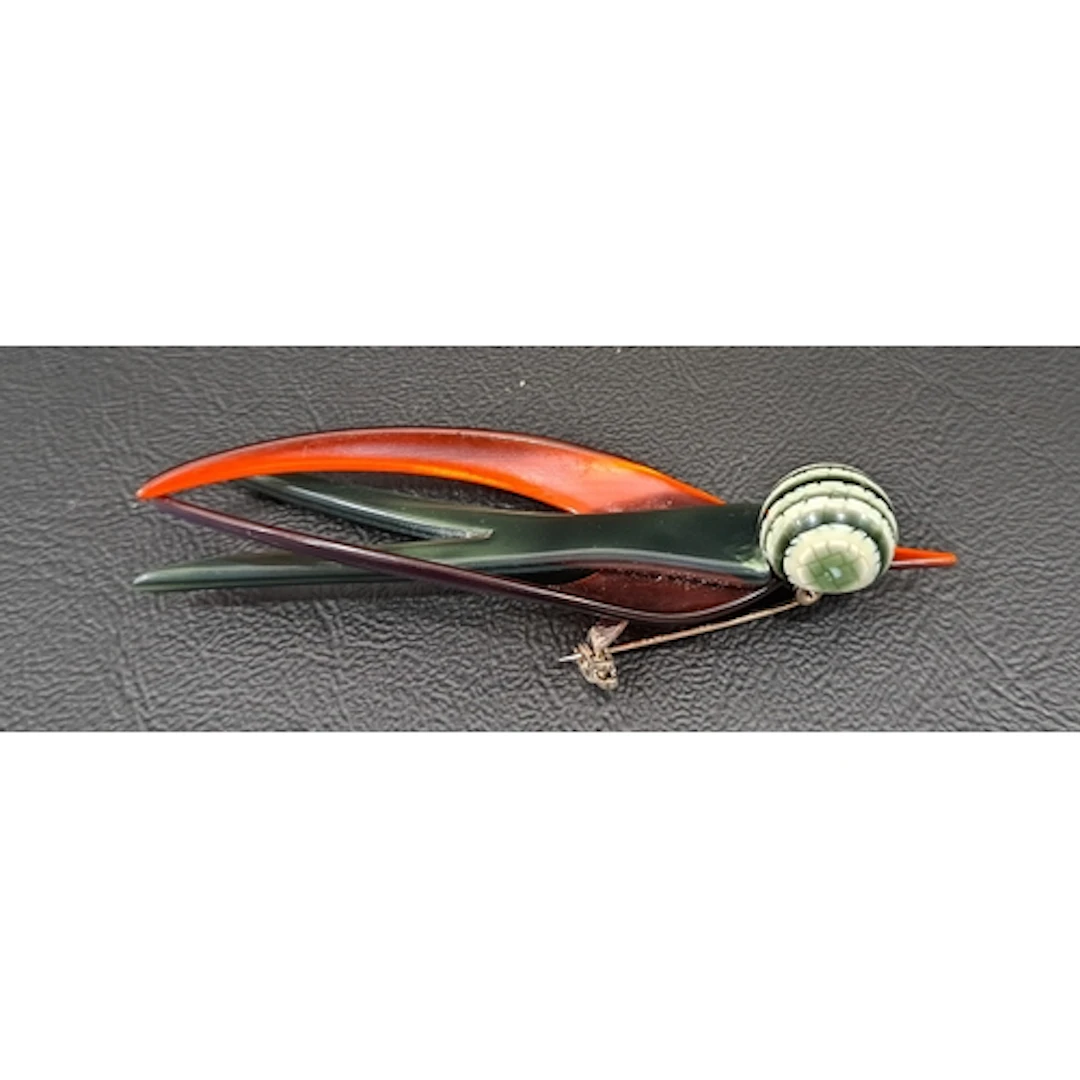 LEA STEIN SWALLOW BROOCH with green body, red wings and beak...