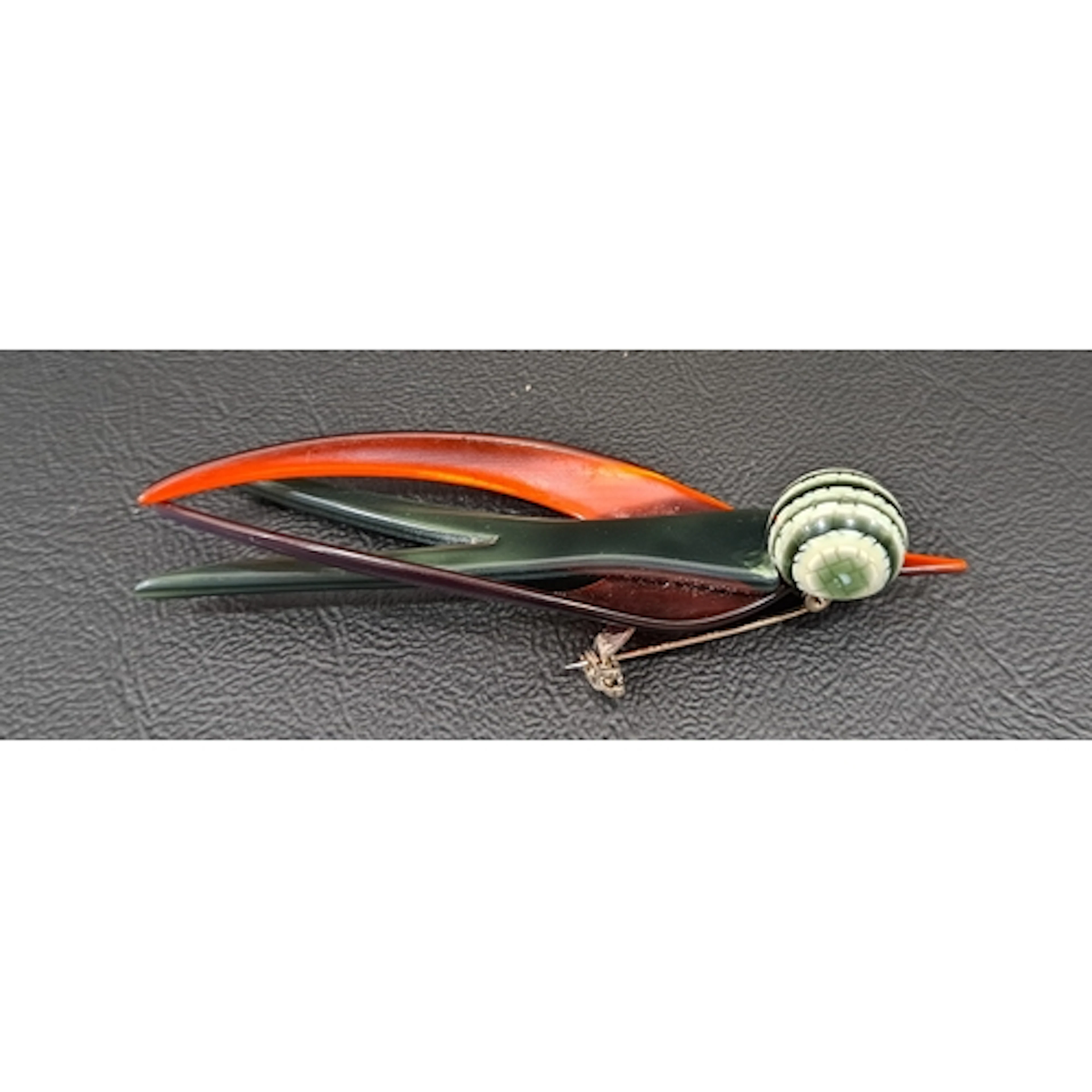 LEA STEIN SWALLOW BROOCH with green body, red wings and beak...