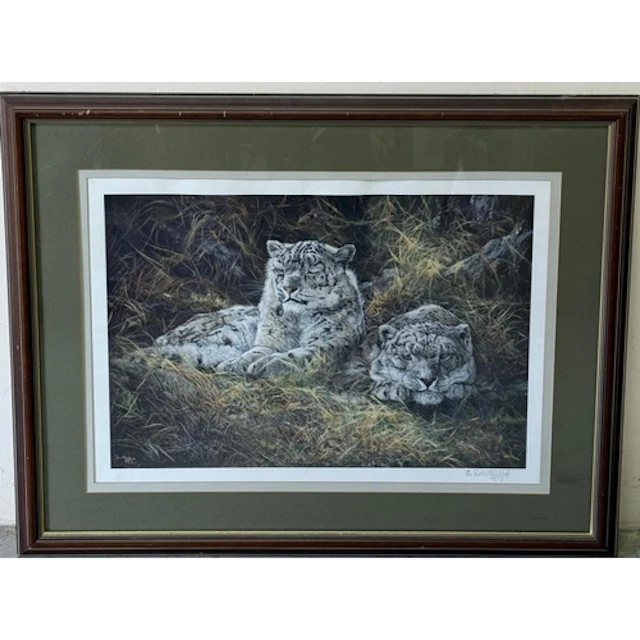 A print of two snow leopards signed and numbered lower right...