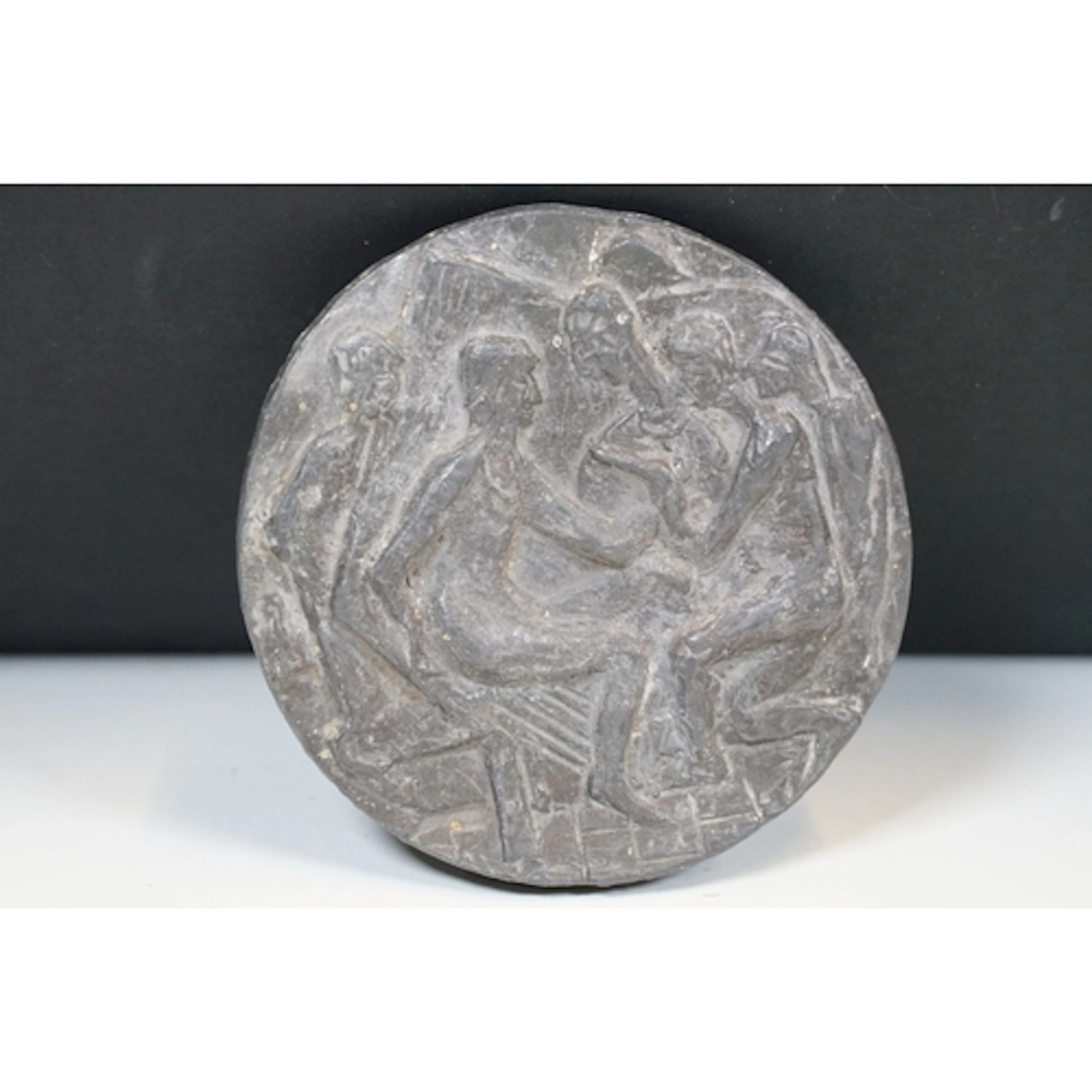 Bronze relief medallion sculpture featuring a figural scene ...