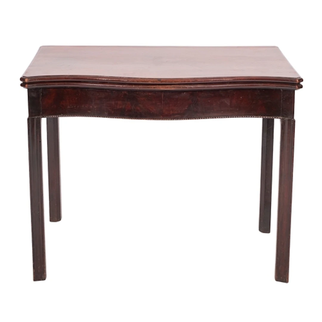 A George III mahogany card table, late 18th century; the hin...