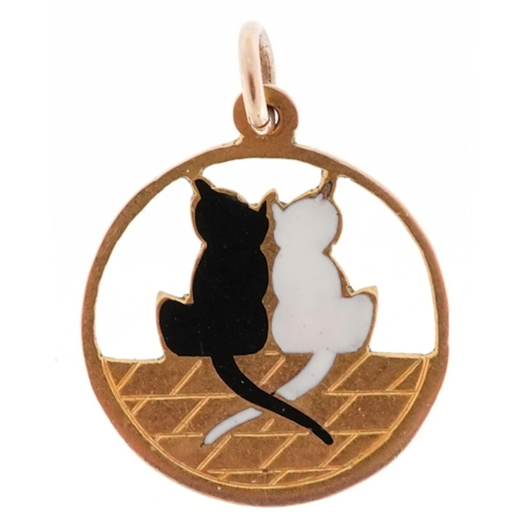 9ct gold and enamel charm in the form of two cats sitting on...