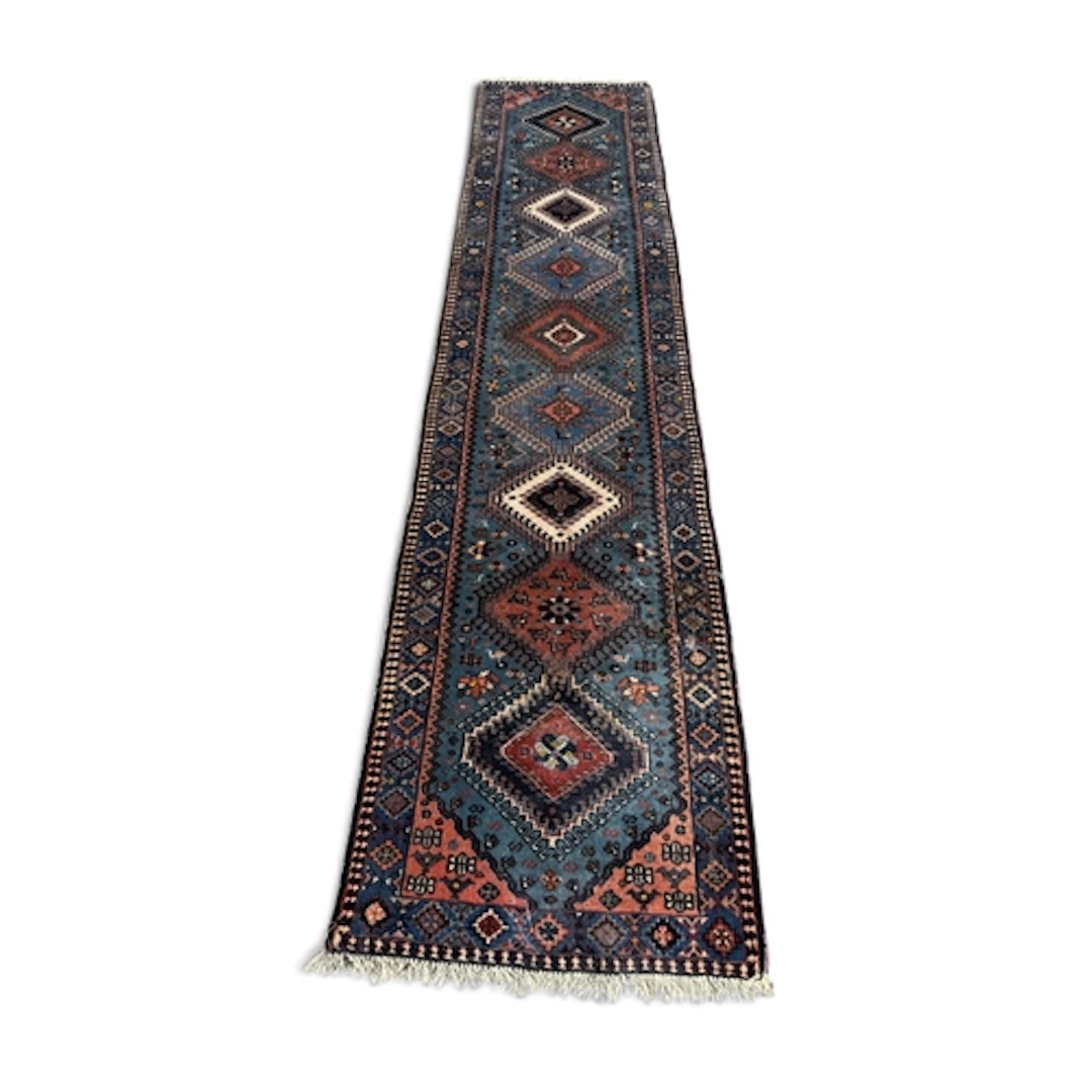 A PERSIAN RUNNER 295cm x 65cm