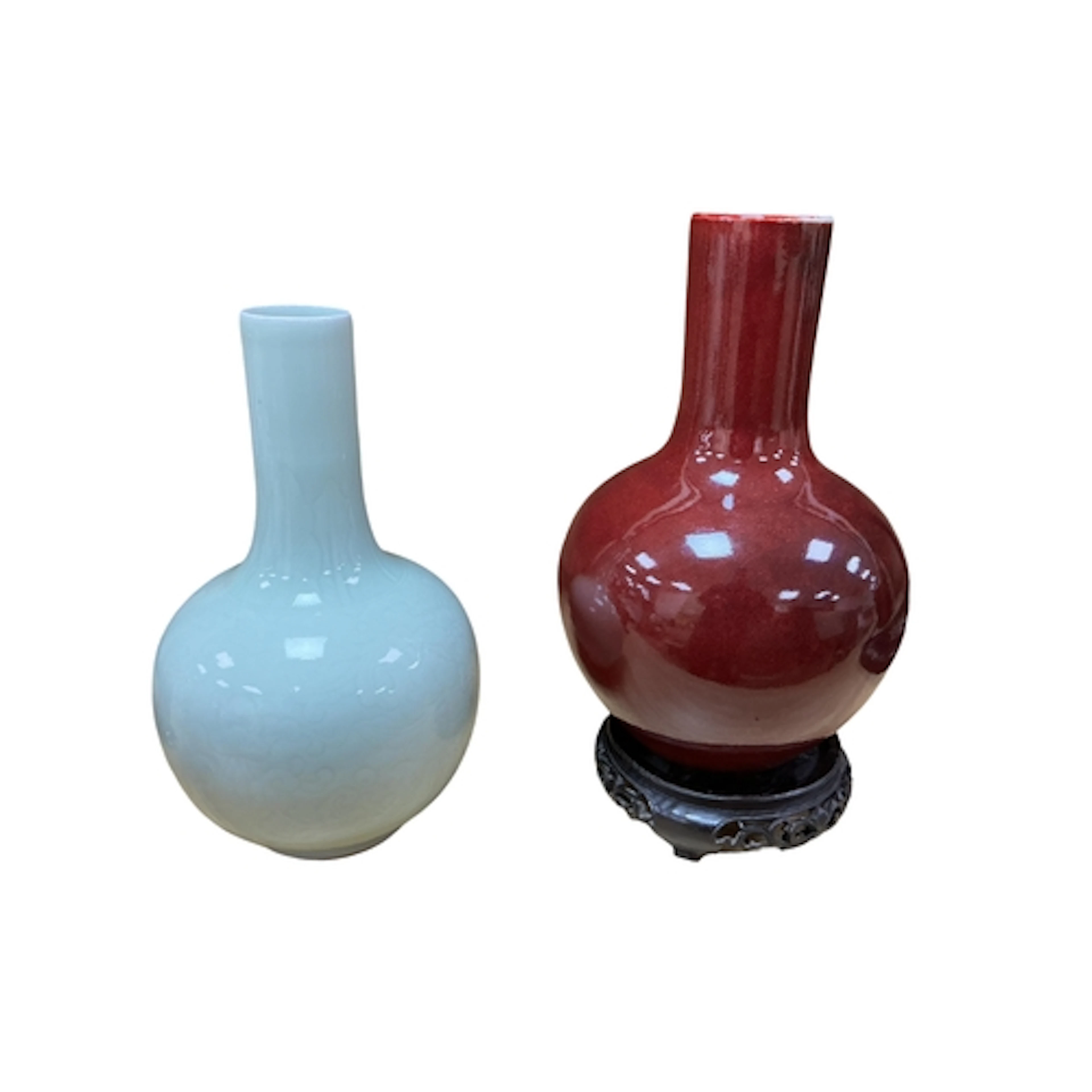 A Chinese sang-de-boeuf glazed bottle vase raised on associa...