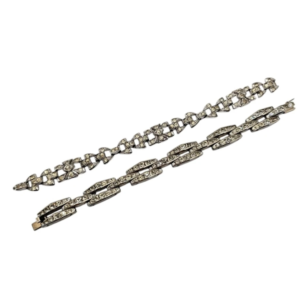 TWO ART DECO WHITE METAL AND DIAMANTÉ BRACELETS To include a...
