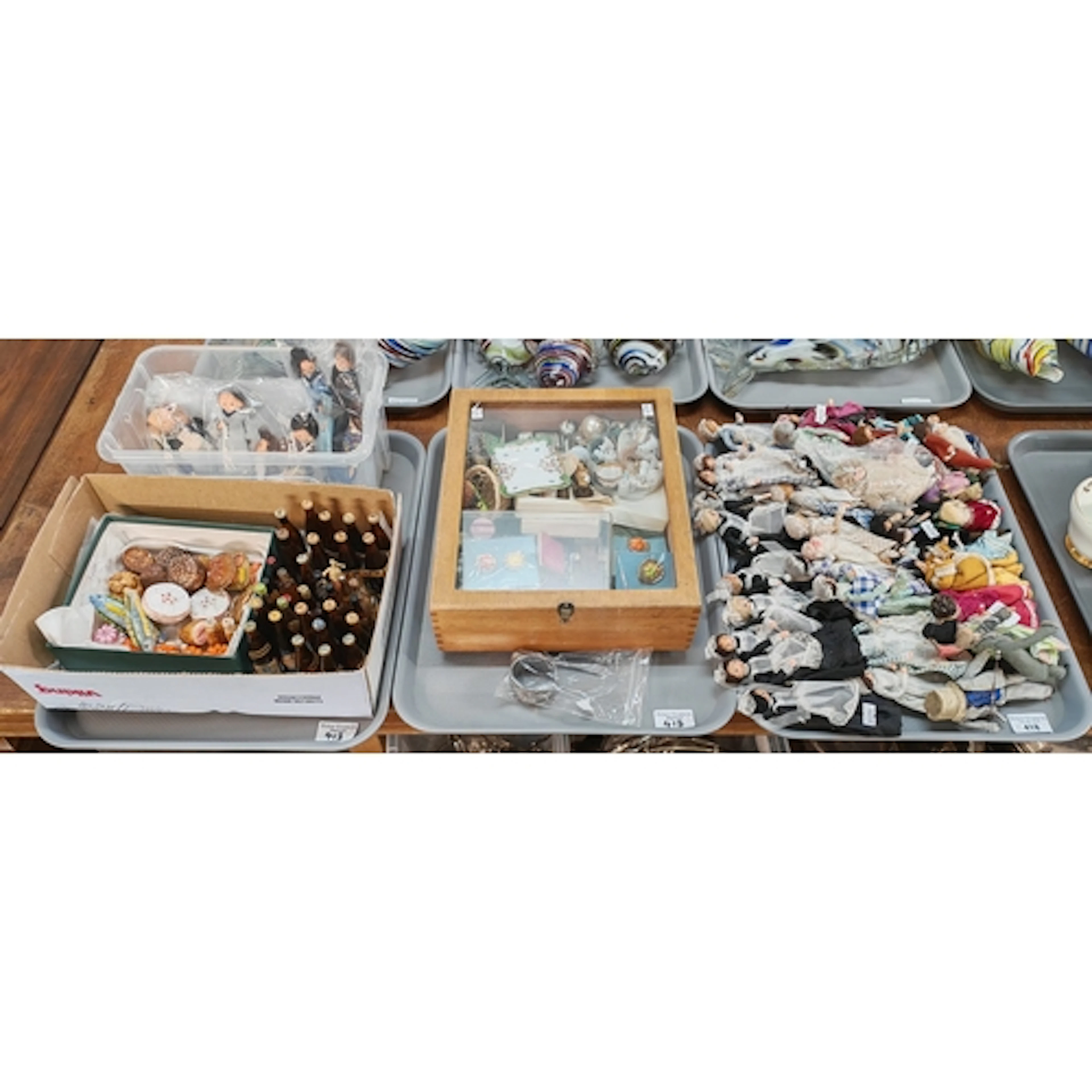 Collection of assorted items to include: various fabric doll...