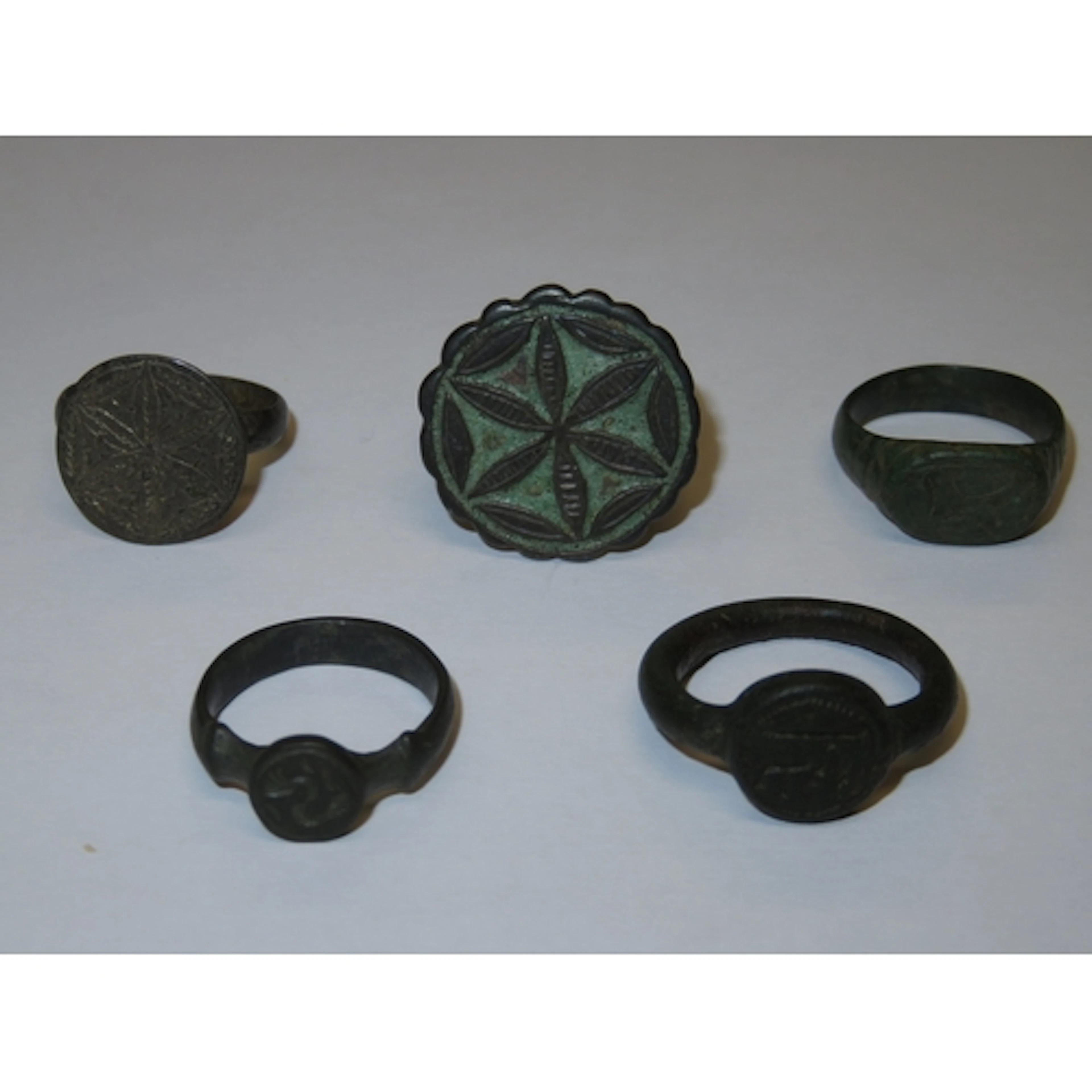 Group of five antique bronze and silver rings with Sygun Mus...