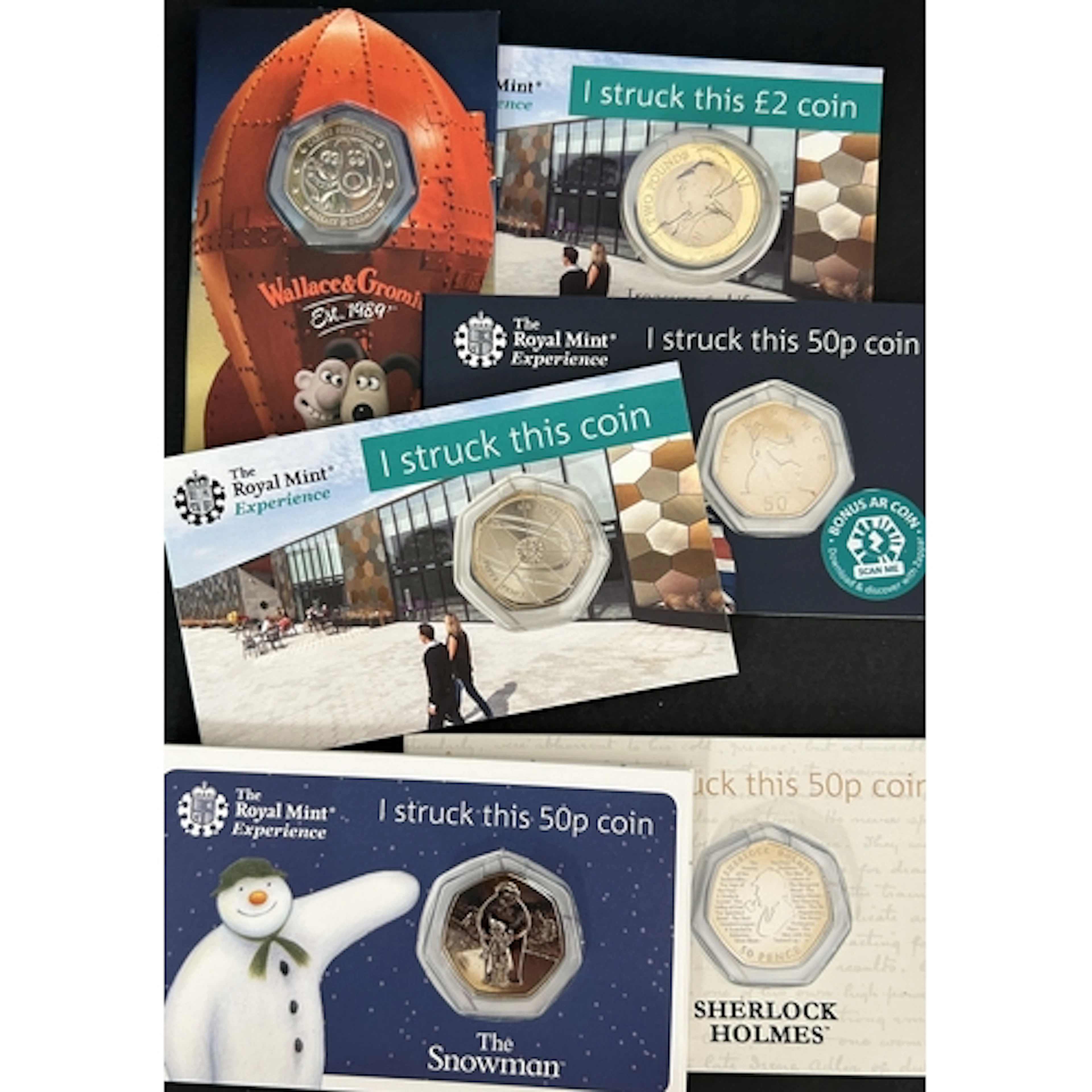A group of six Royal Mint Experience Strike Your Own cupro-n...