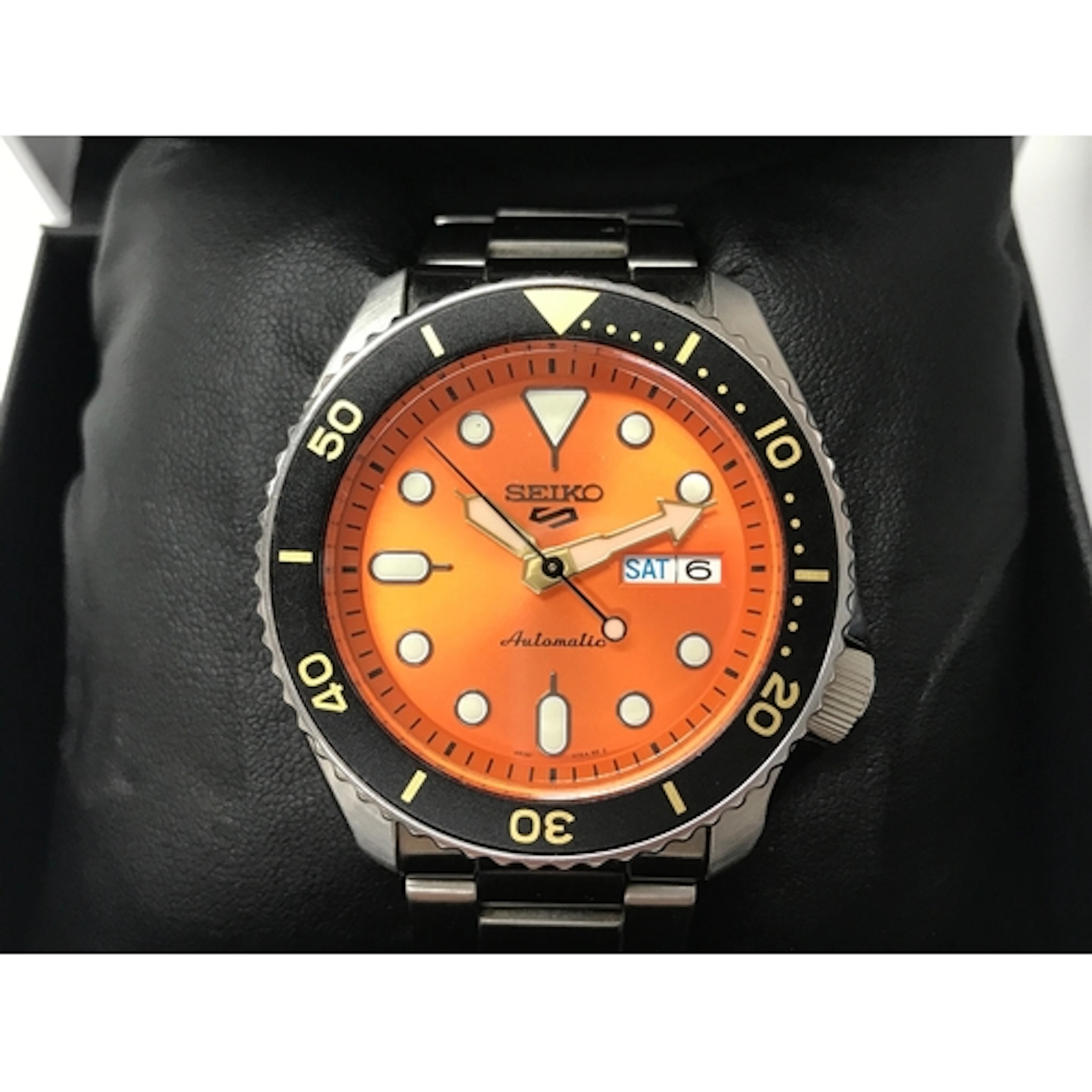 Seiko 5 Sport automatic watch featuring an orange dial and a...
