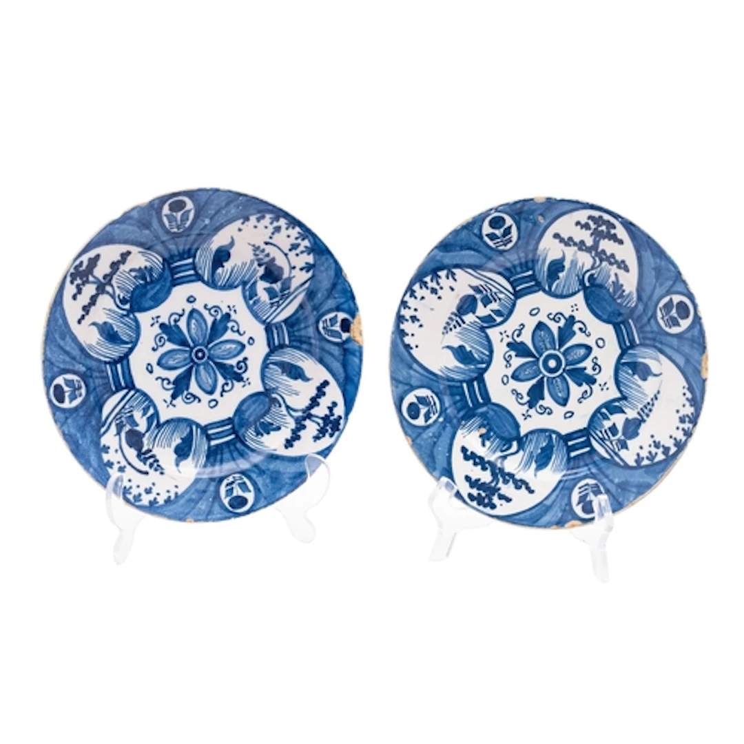 A pair of Dutch blue and white delftware pancake plates, mid...