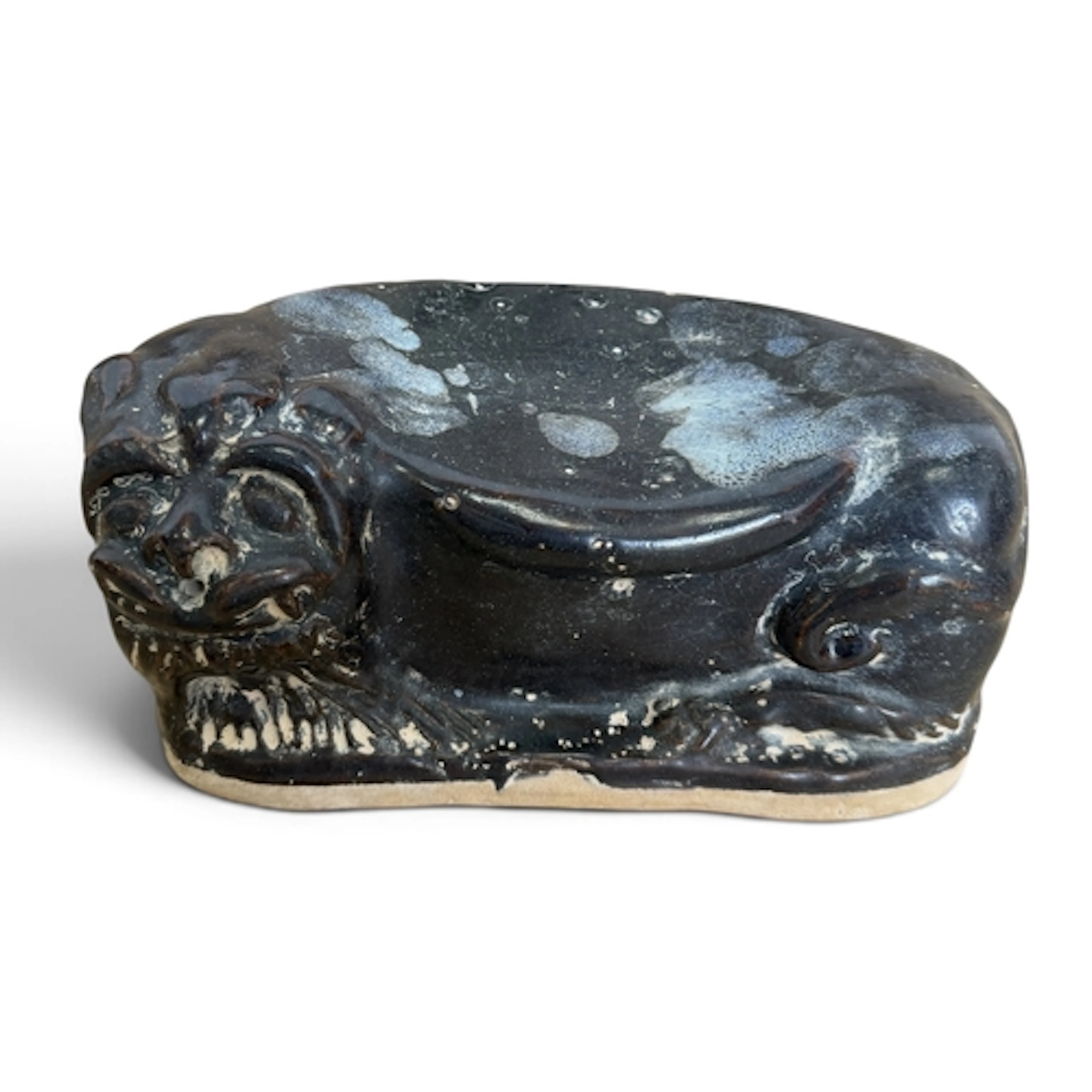 A CHINESE QING DYNASTY PILLOW In the form of a lion dog. 21 ...