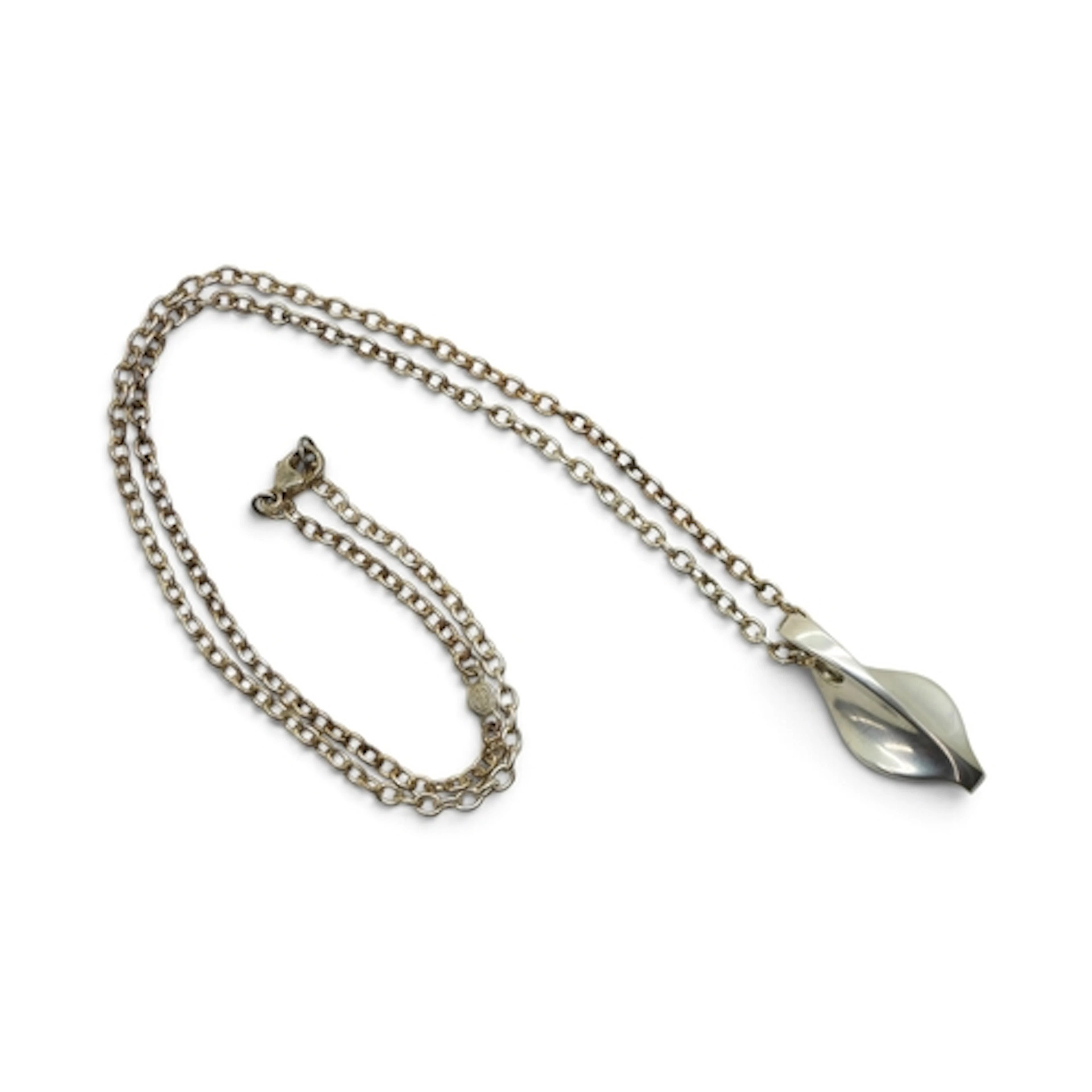 A GEORG JENSEN SILVER PENDANT of freeform shape stamped with...