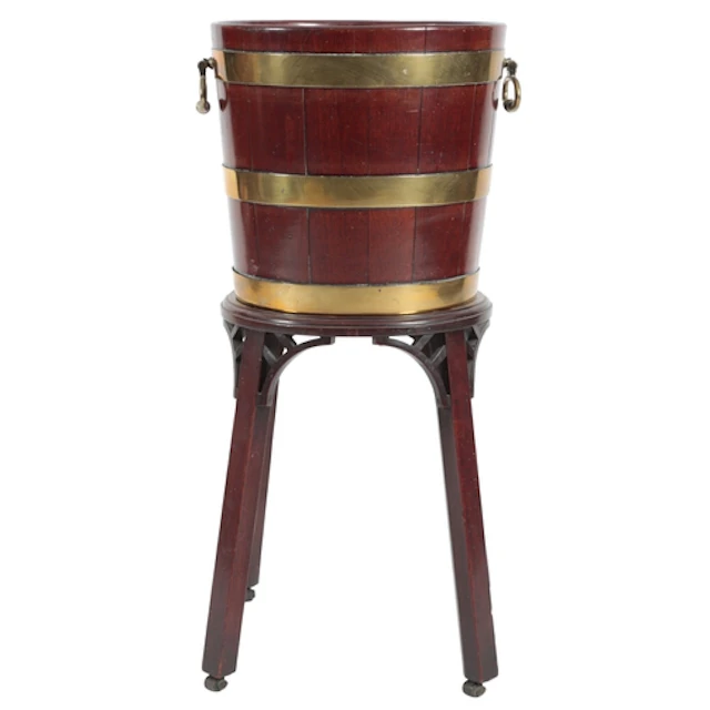 A George III mahogany and brass bound bucket on stand, circa...