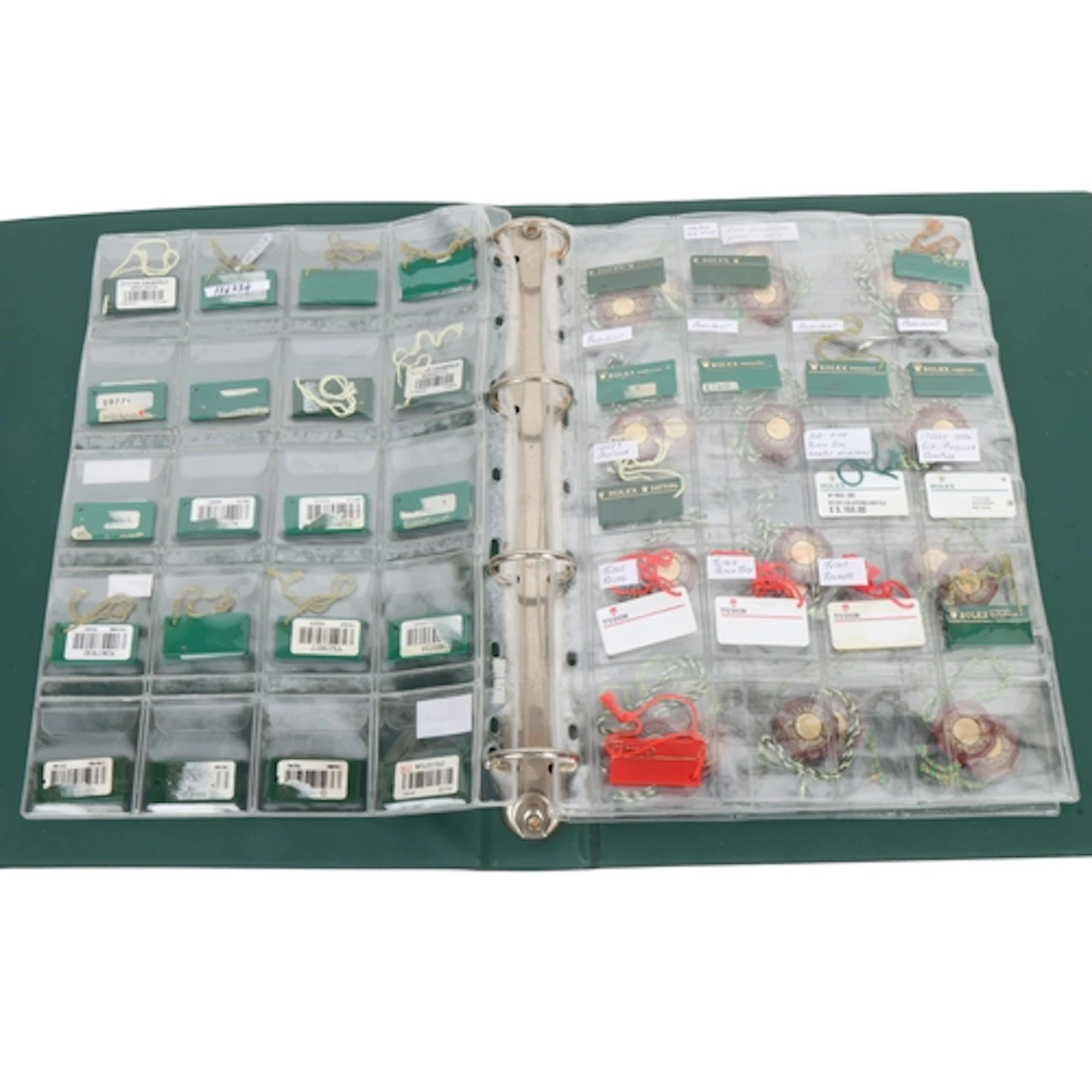 ROLEX - a folder of watch sales tags and chronometer tags