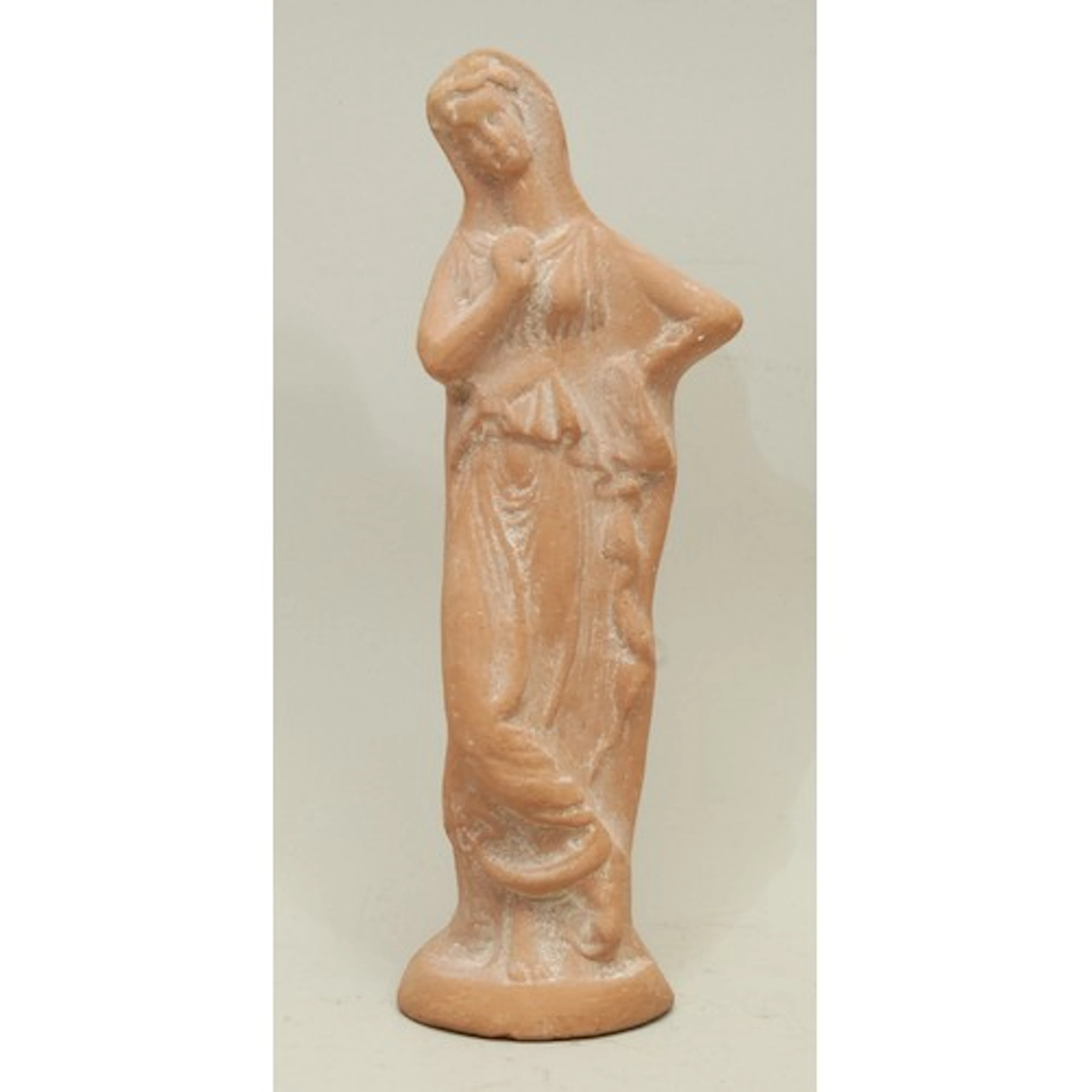 Interior Decoration - a Tanagra style terracotta figure, aft...