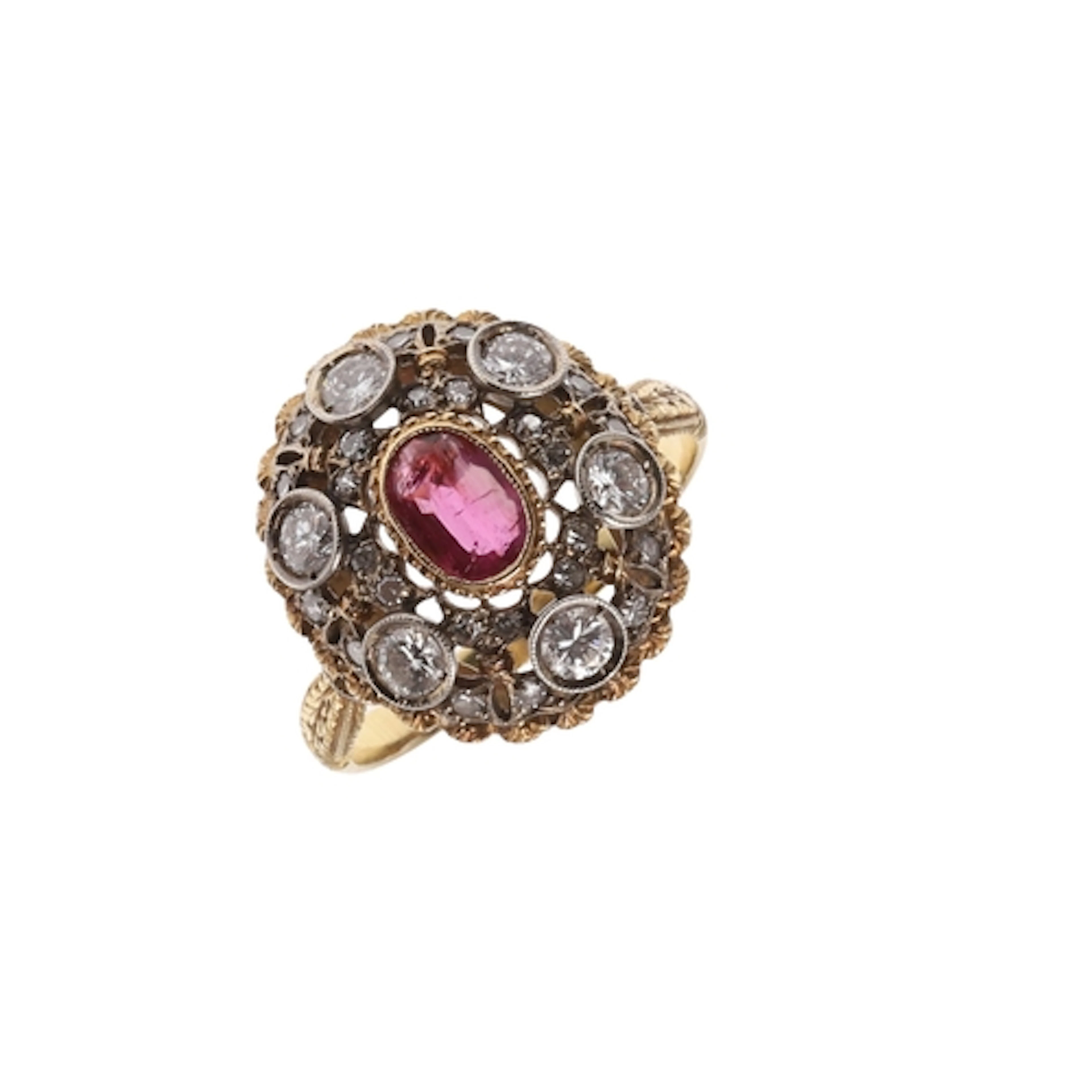 A RUBY AND DIAMOND CLUSTER RING. the oval-shaped ruby is set...