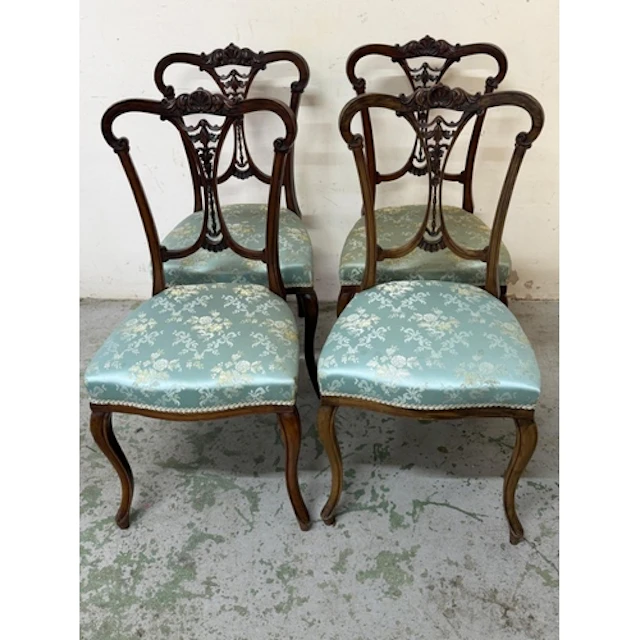 A Set of four victorian side chairs with pierced splat backs...