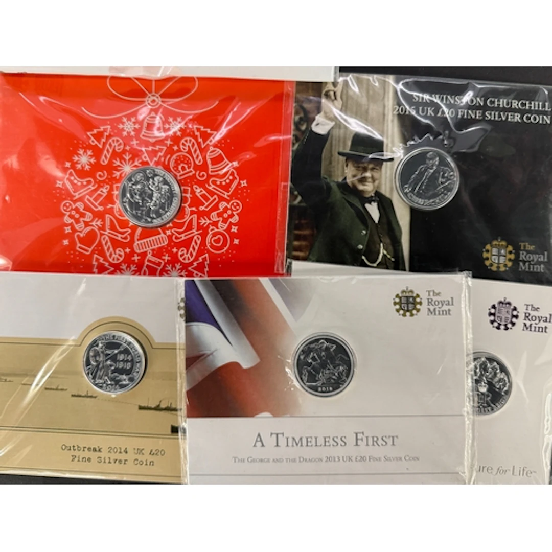 A group of five UK QEII brilliant uncirculated fine silver £...
