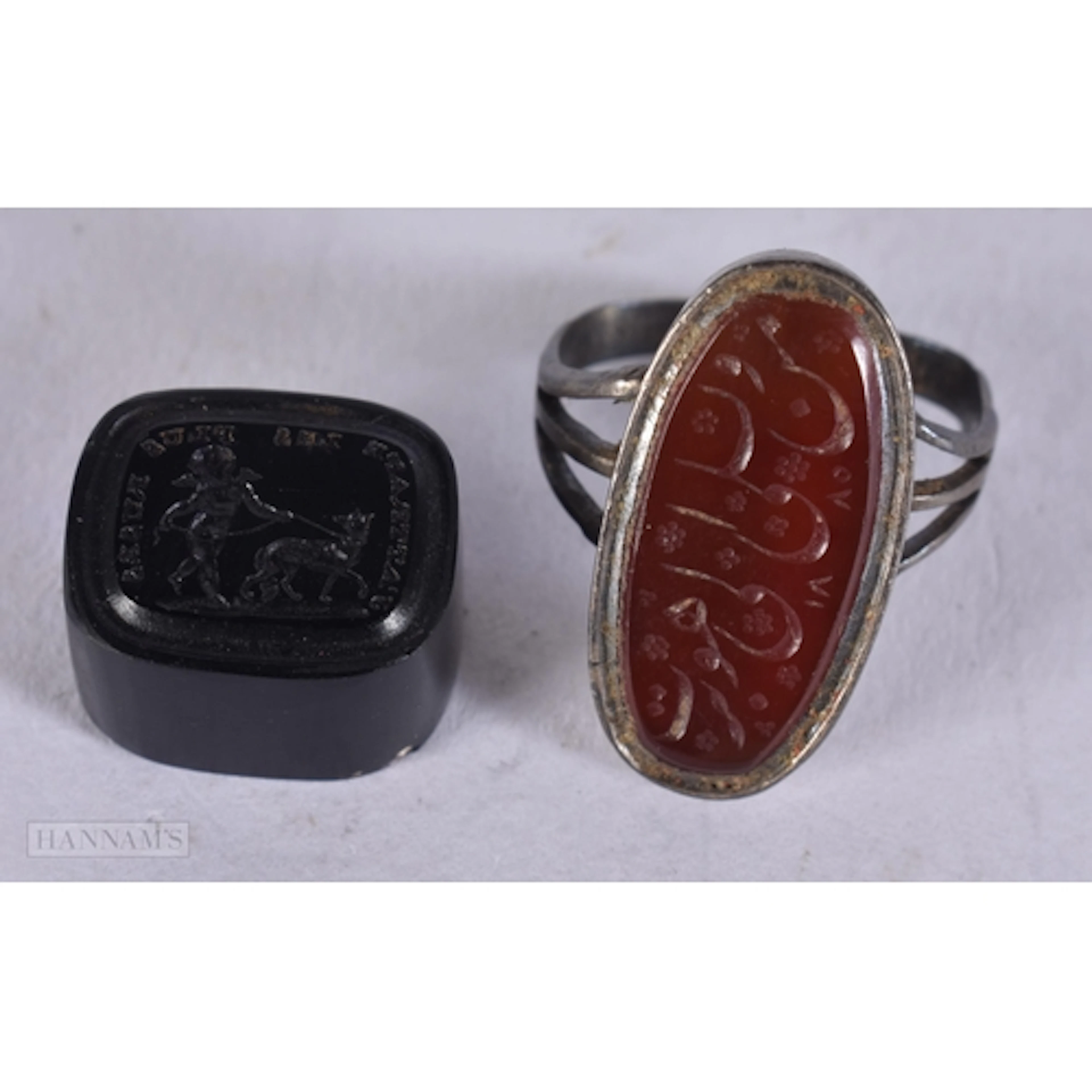 AN ANTIQUE AMETHYST INTAGLIO SEAL bearing label Ex Hampton C...