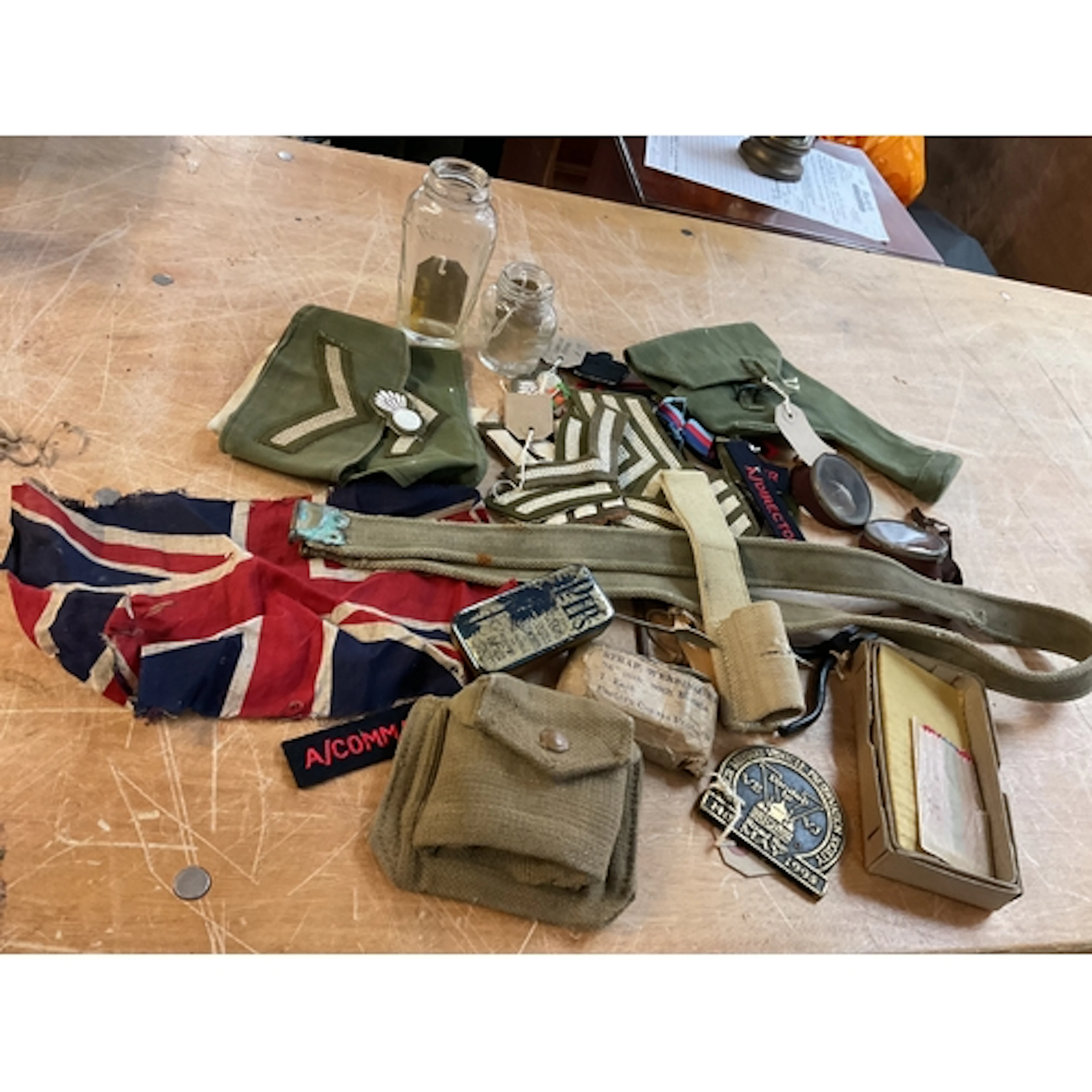Qty WWII items to include webbing, insignia, Brylcreem bottl...