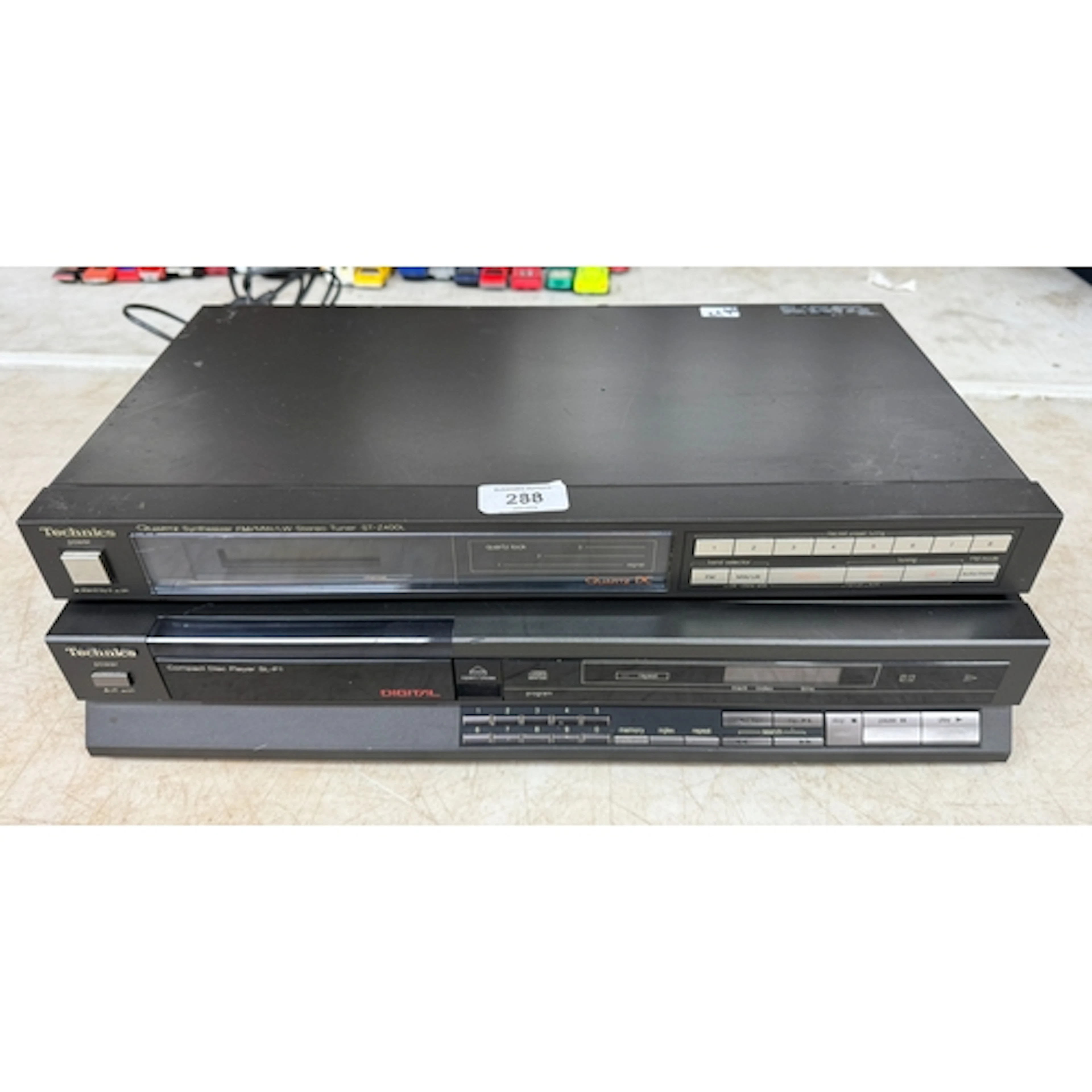A Technics compact disk player together with a Technics quar...