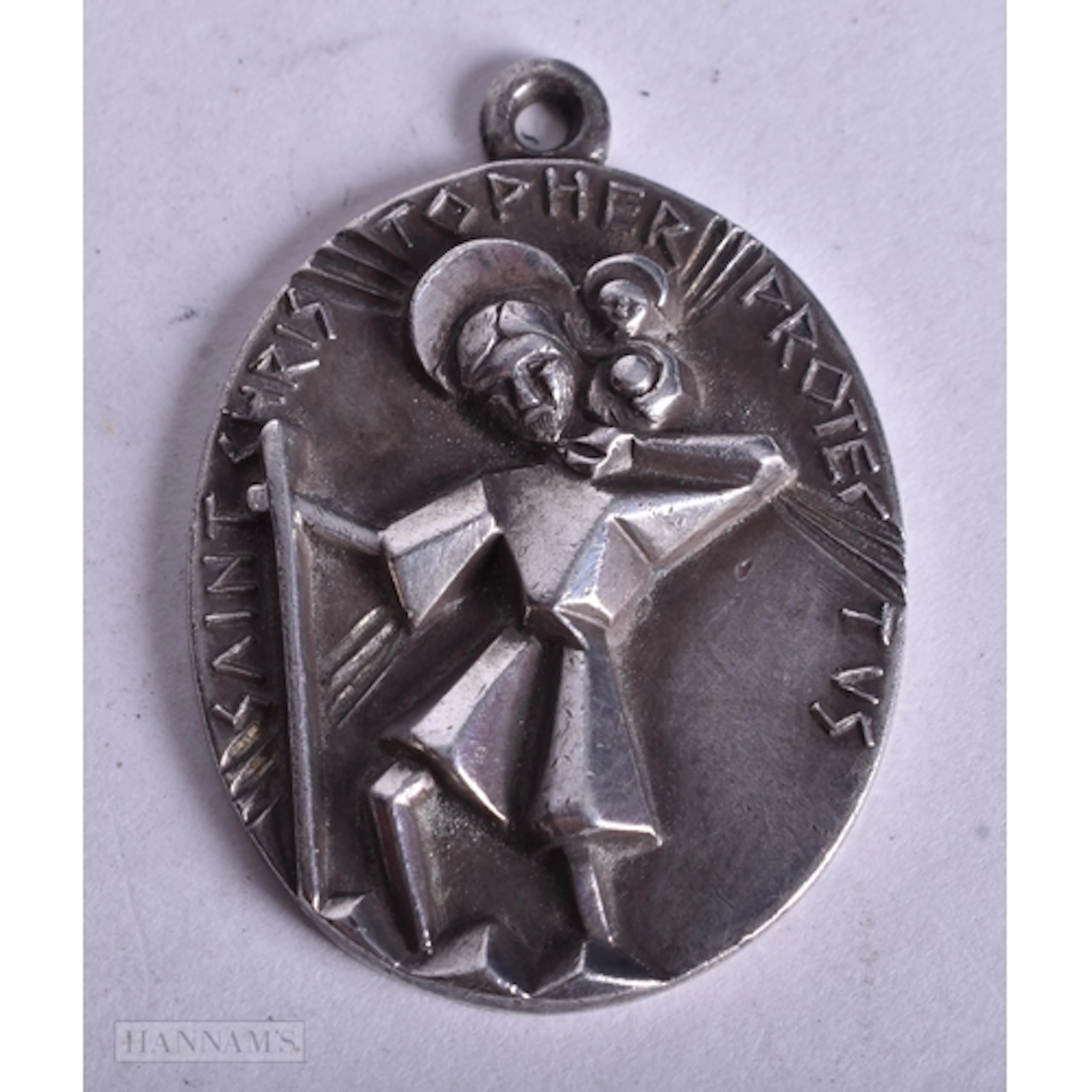 A Vintage Silver Tone St Christophe Pendant featuring a Geom...