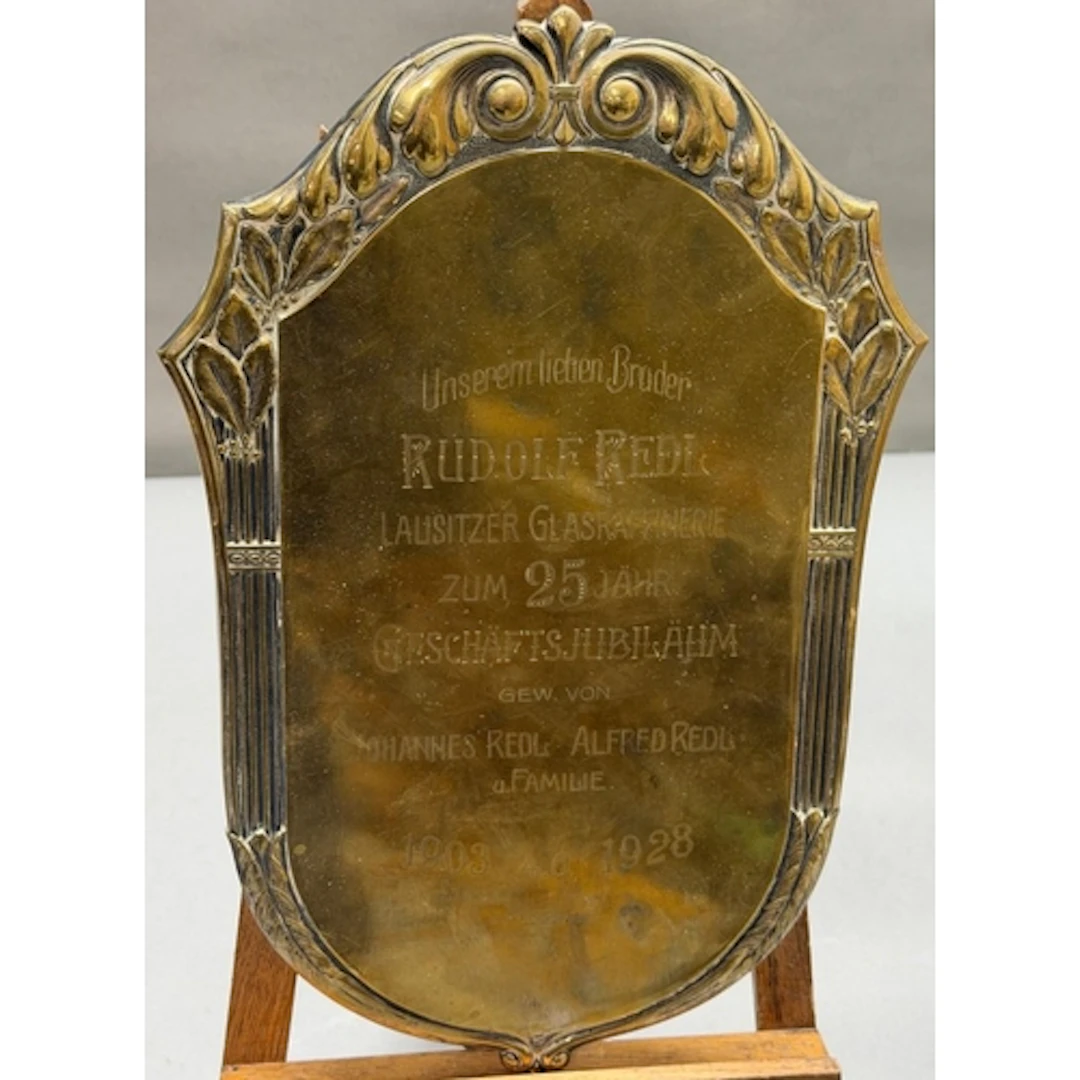 A German glass factory's 25th commemorative wall plaque from...