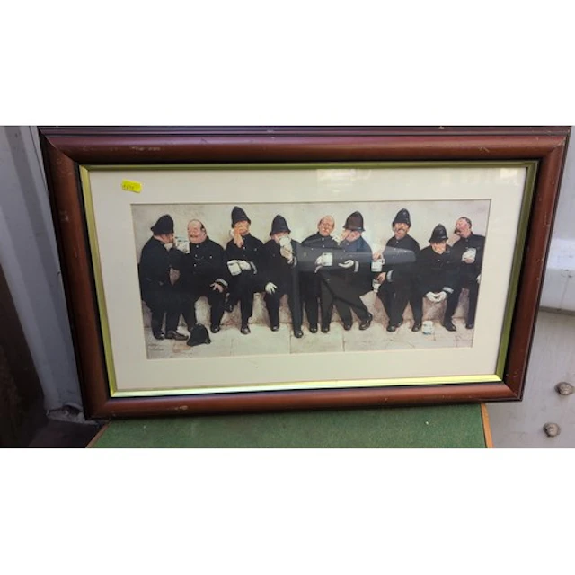 Framed colour print depicting uniformed policemen seated in ...