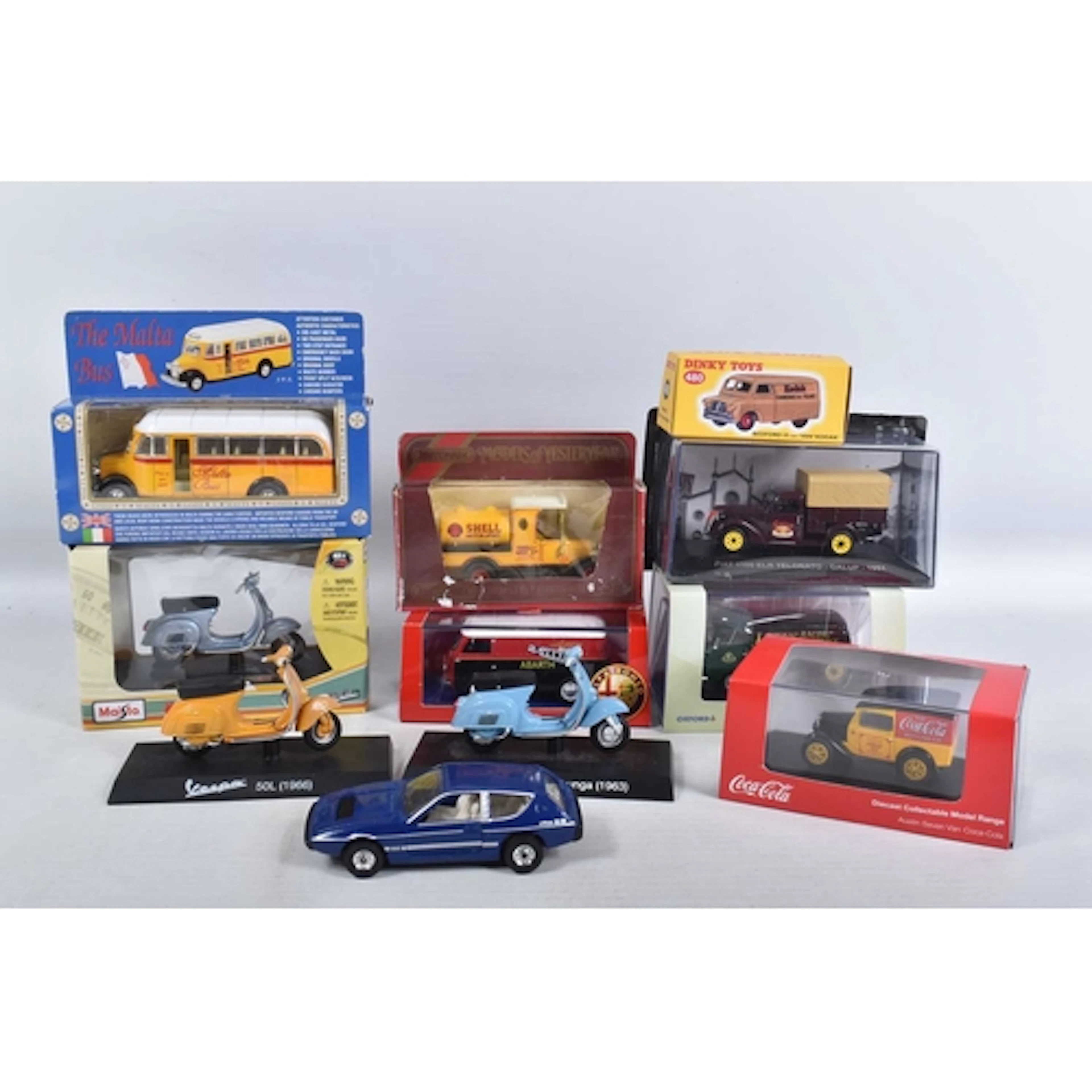 A COLLECTION OF ELEVEN DIECAST MODEL VEHICLES, to include a ...