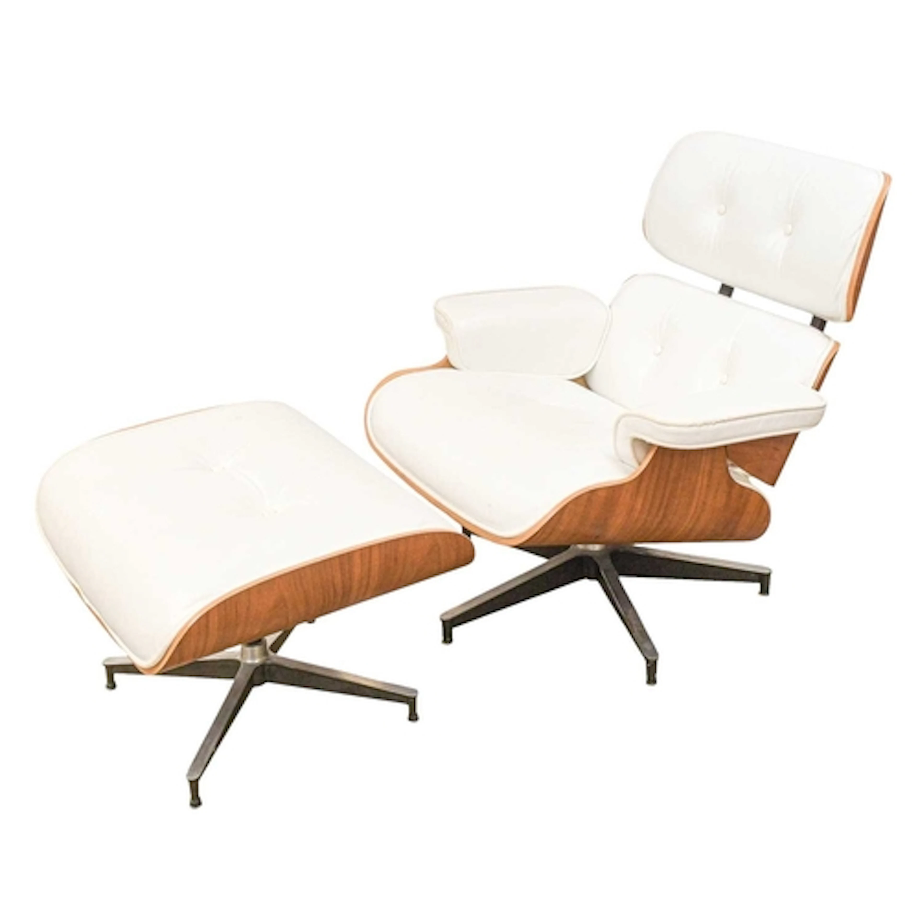 After Charles Eames, a lounge chair and ottoman. With white ...