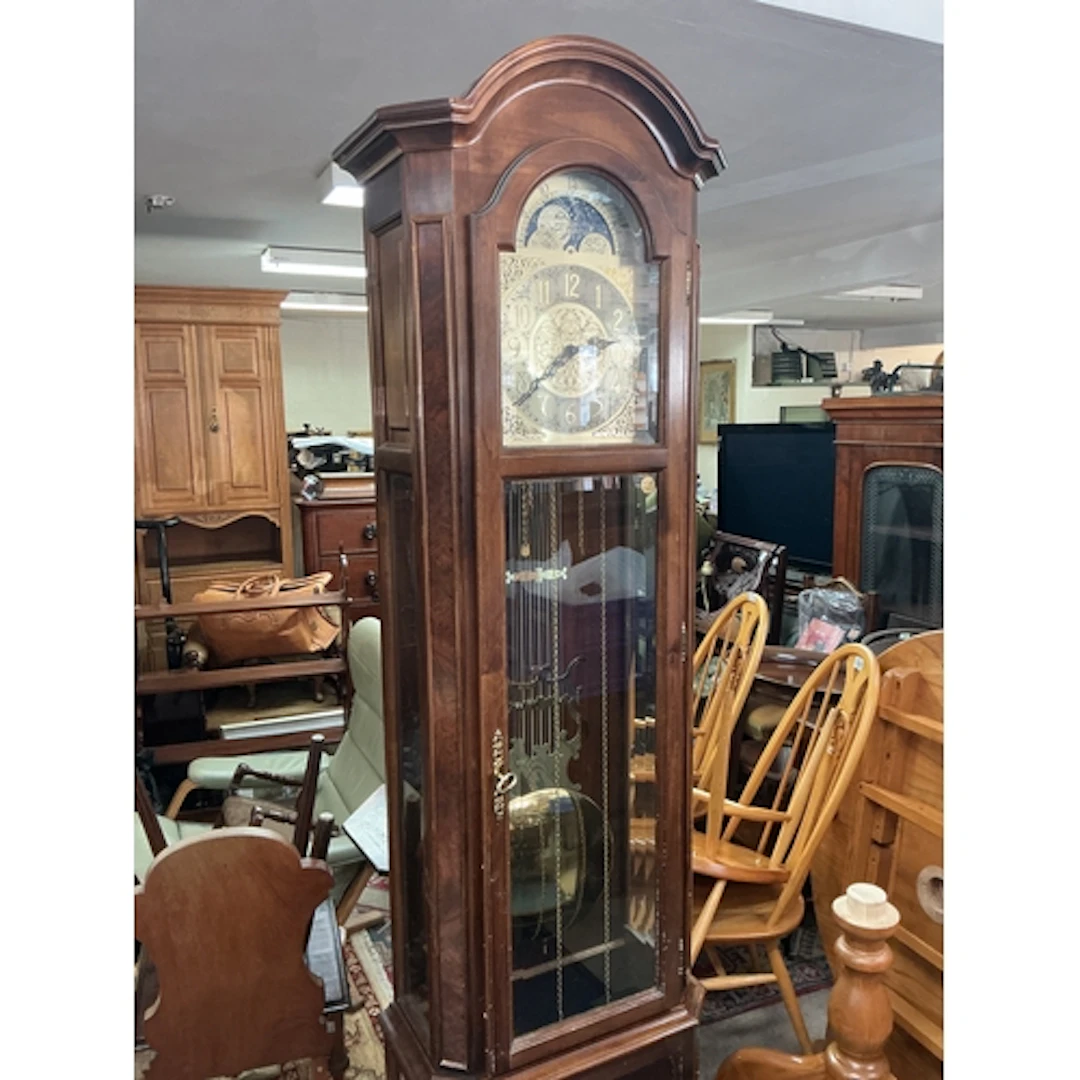 A Walnut Grandfather Clock by Interclock circa 1980s. With p...