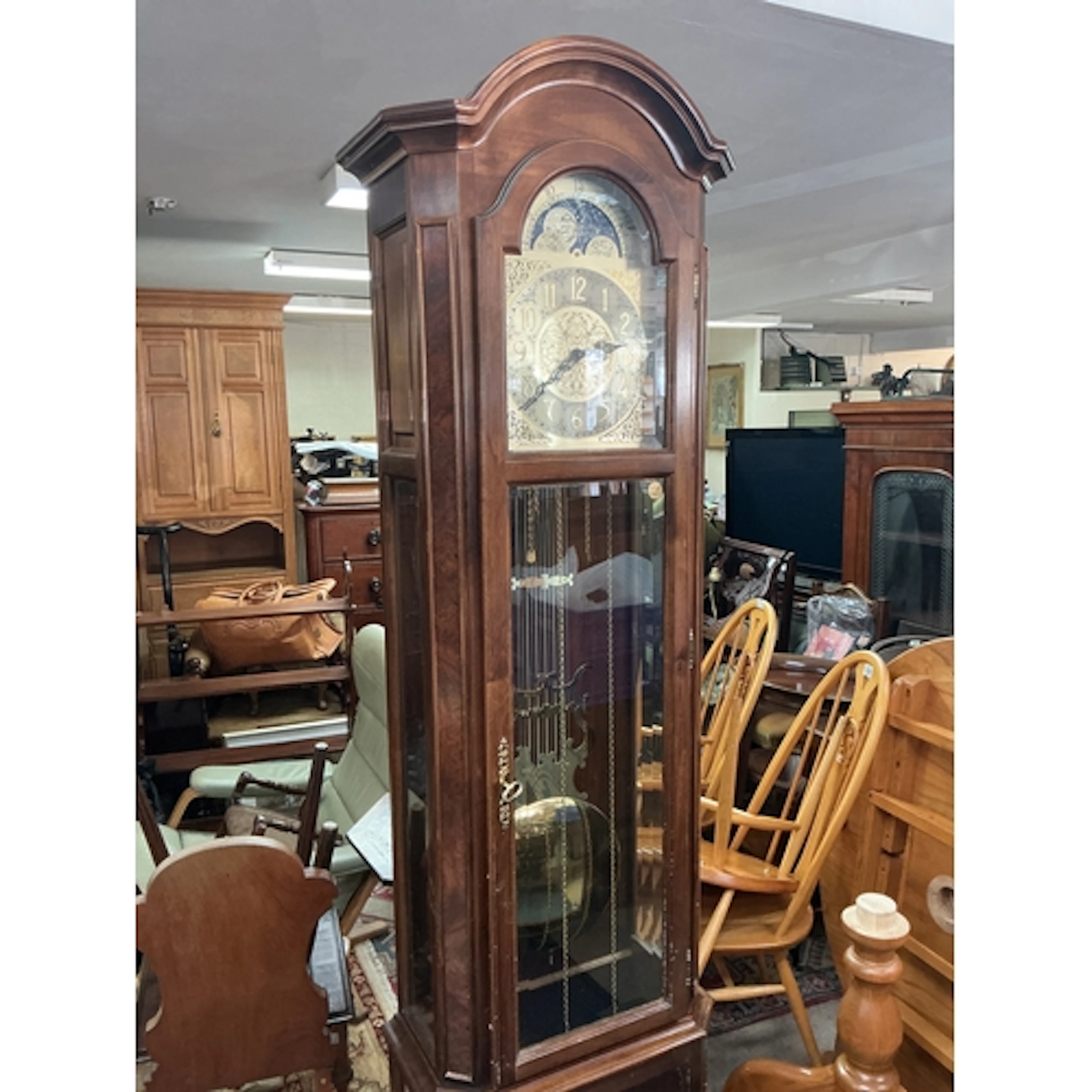A Walnut Grandfather Clock by Interclock circa 1980s. With p...