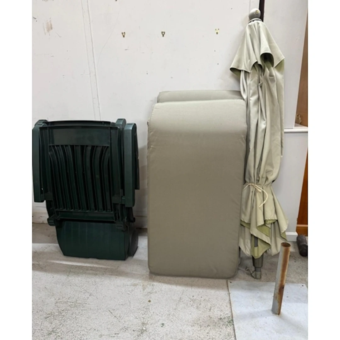 Two Nardi green garden sun loungers with cushions together w...