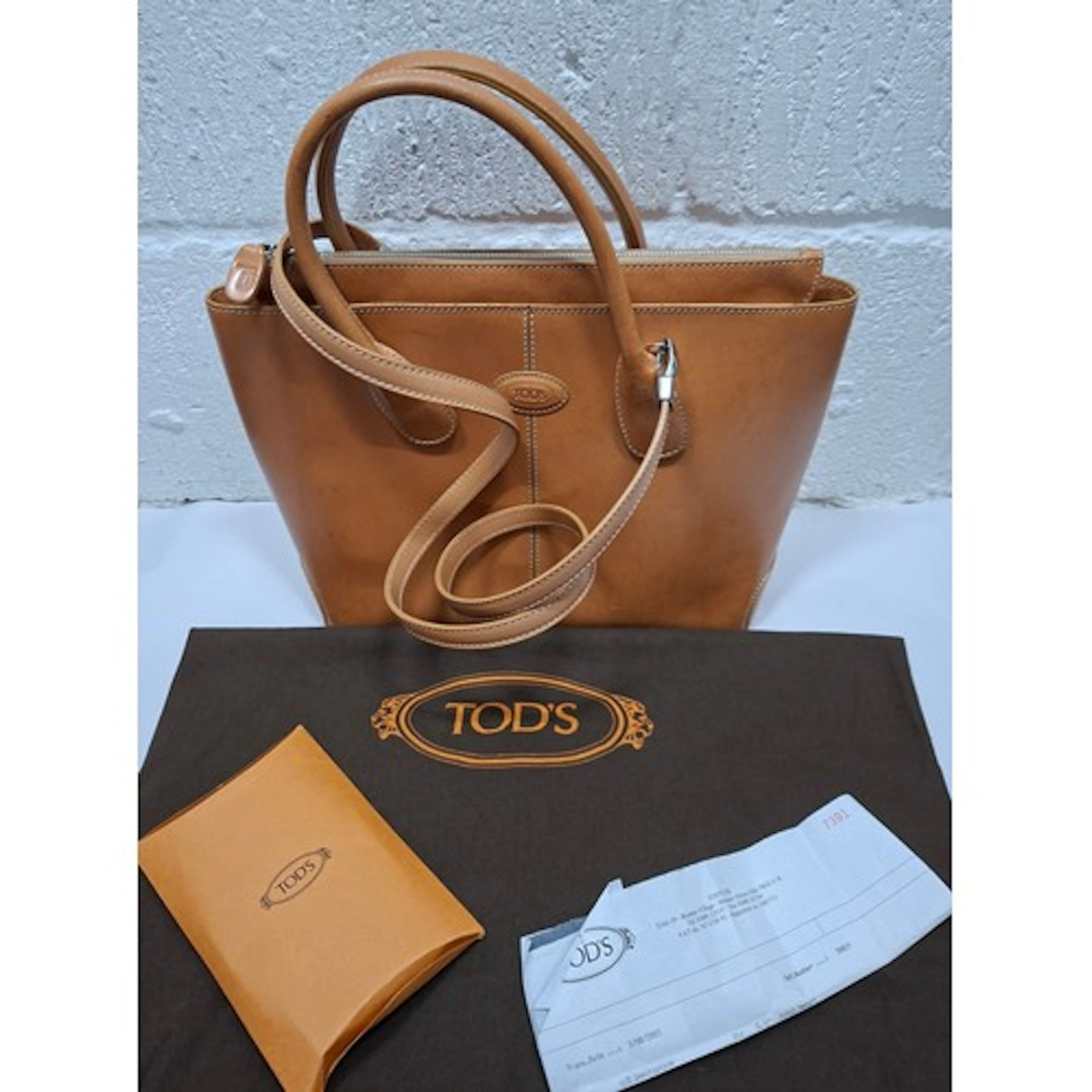 Tods- A light tan leather 'Di' handbag having silver tone ha...
