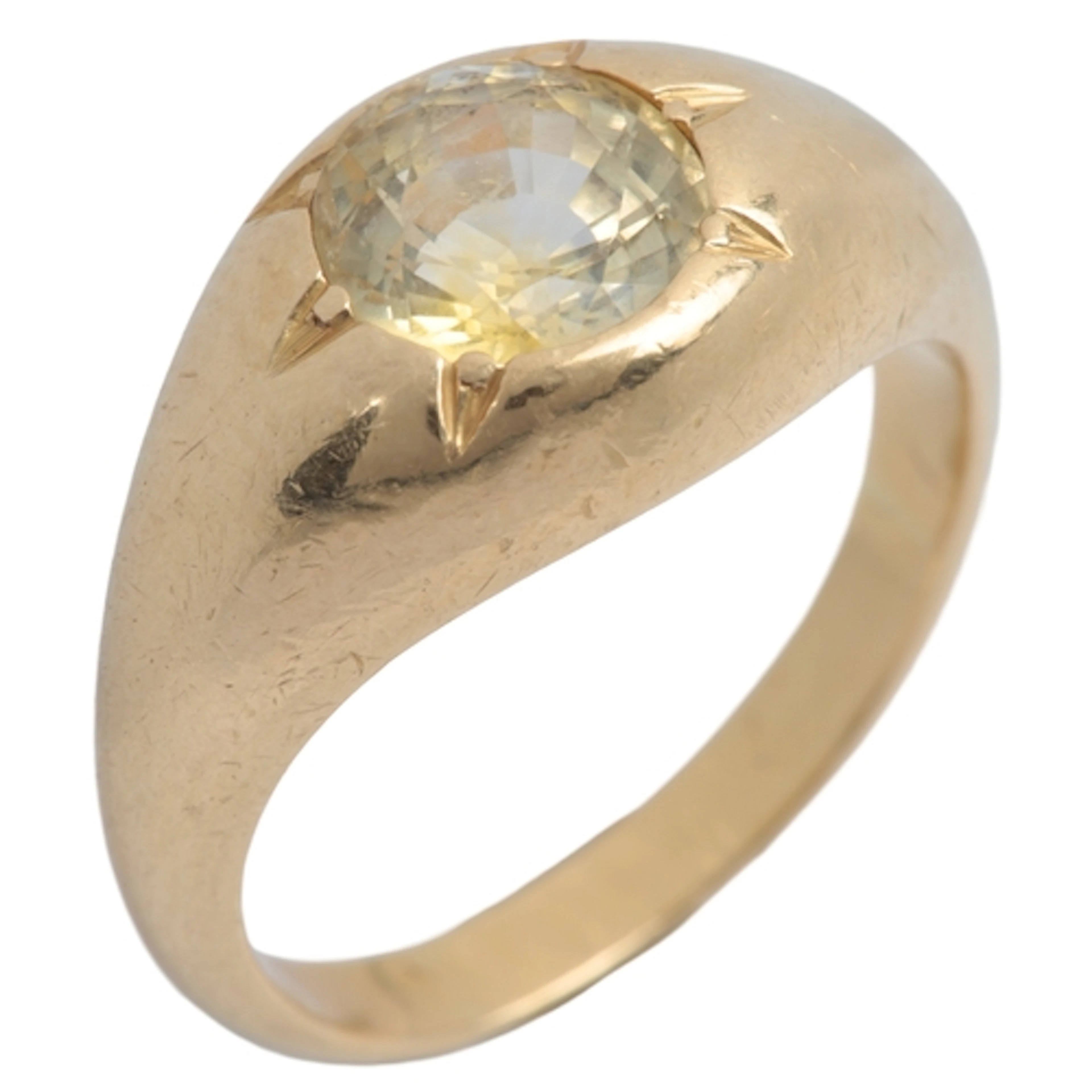 A gold and yellow sapphire ring, rub over-set with a circula...