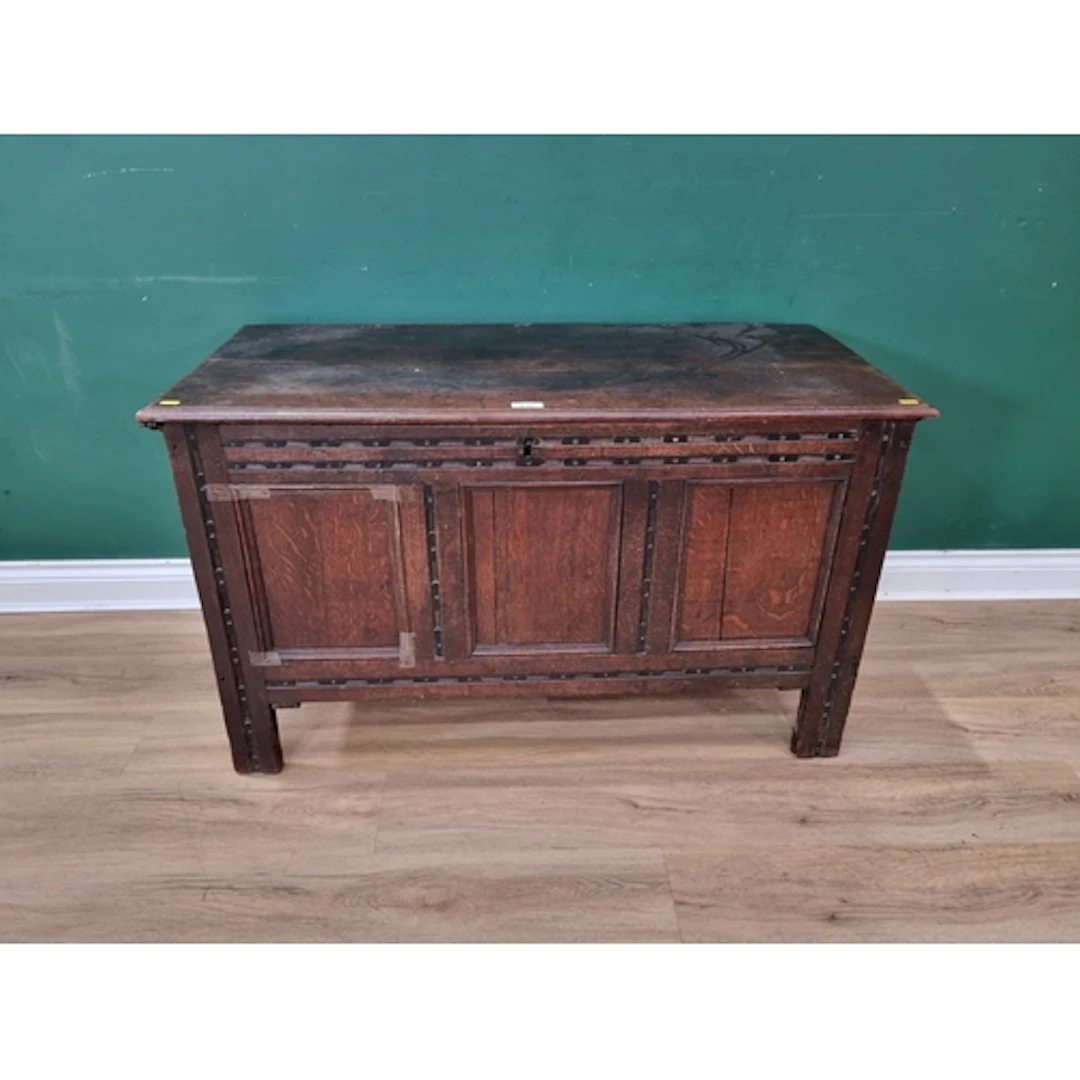 A three panelled oak Coffer, 2ft 2" H 3ft 9" W 1ft 9" D (R6)...