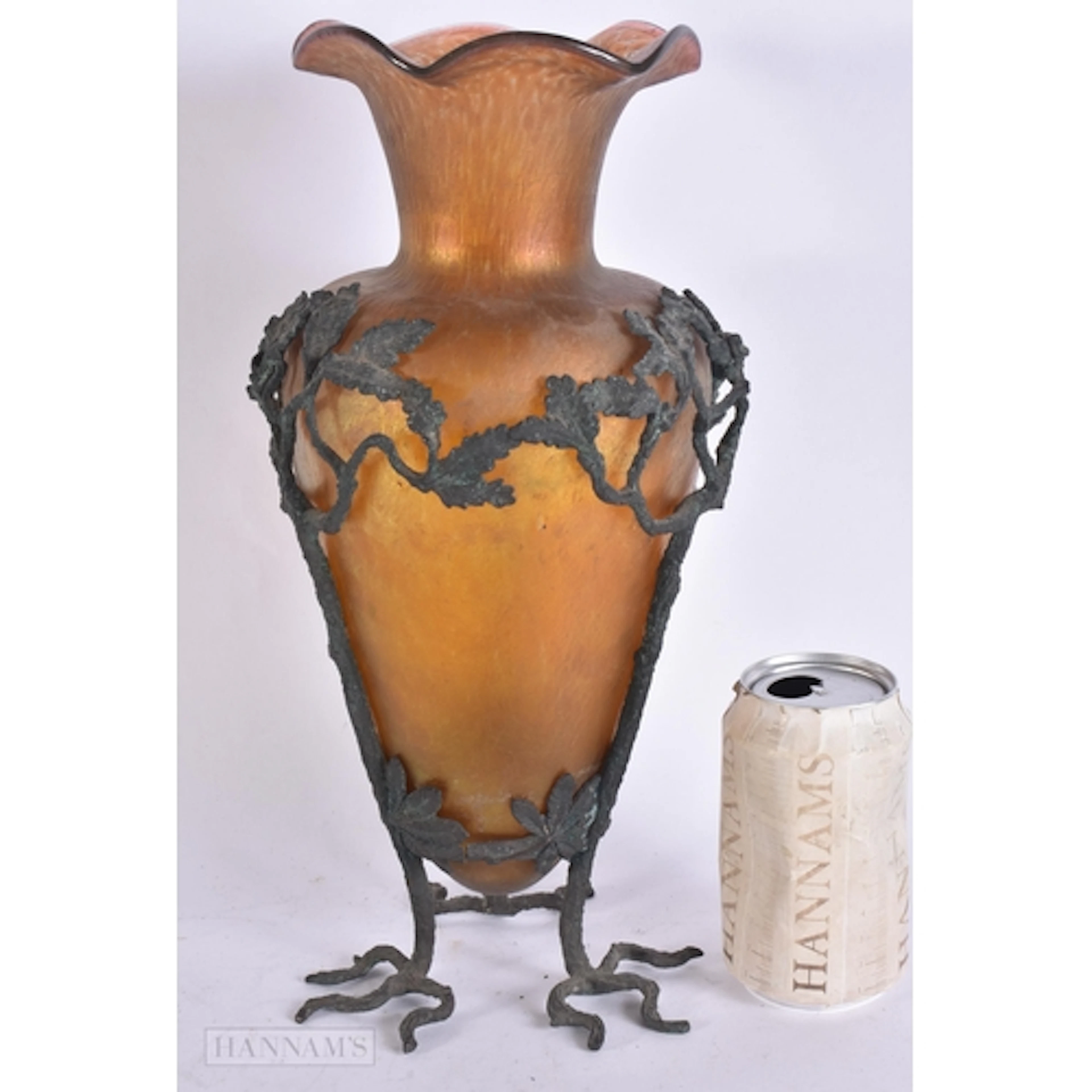 AN ART NOUVEAU AUSTRIAN IRIDESCENT GLASS VASE within a bronz...