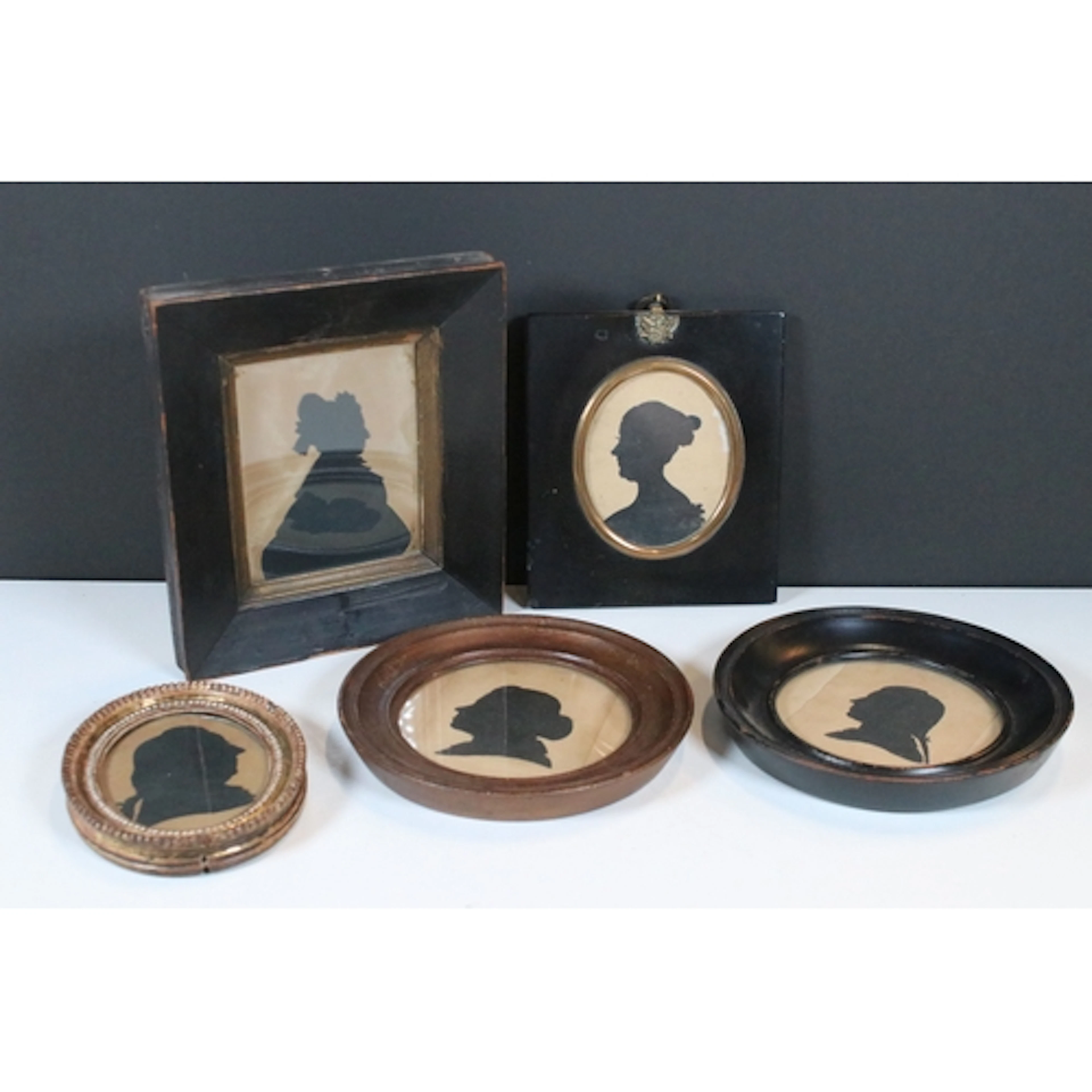 Five late 19th/early 20th century framed silhouettes, larges...