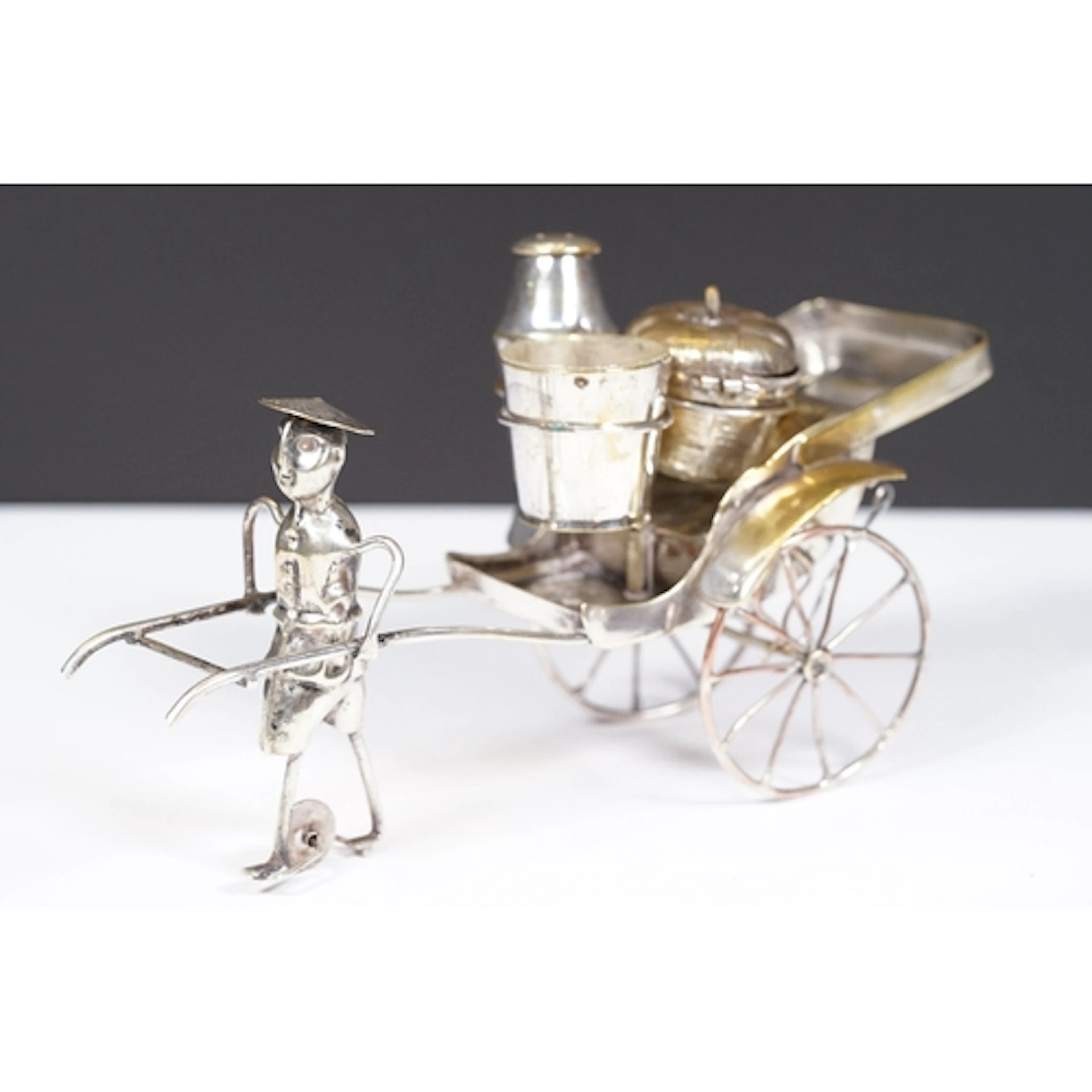 A vintage Chinese silver plated cruet set in the form of a m...