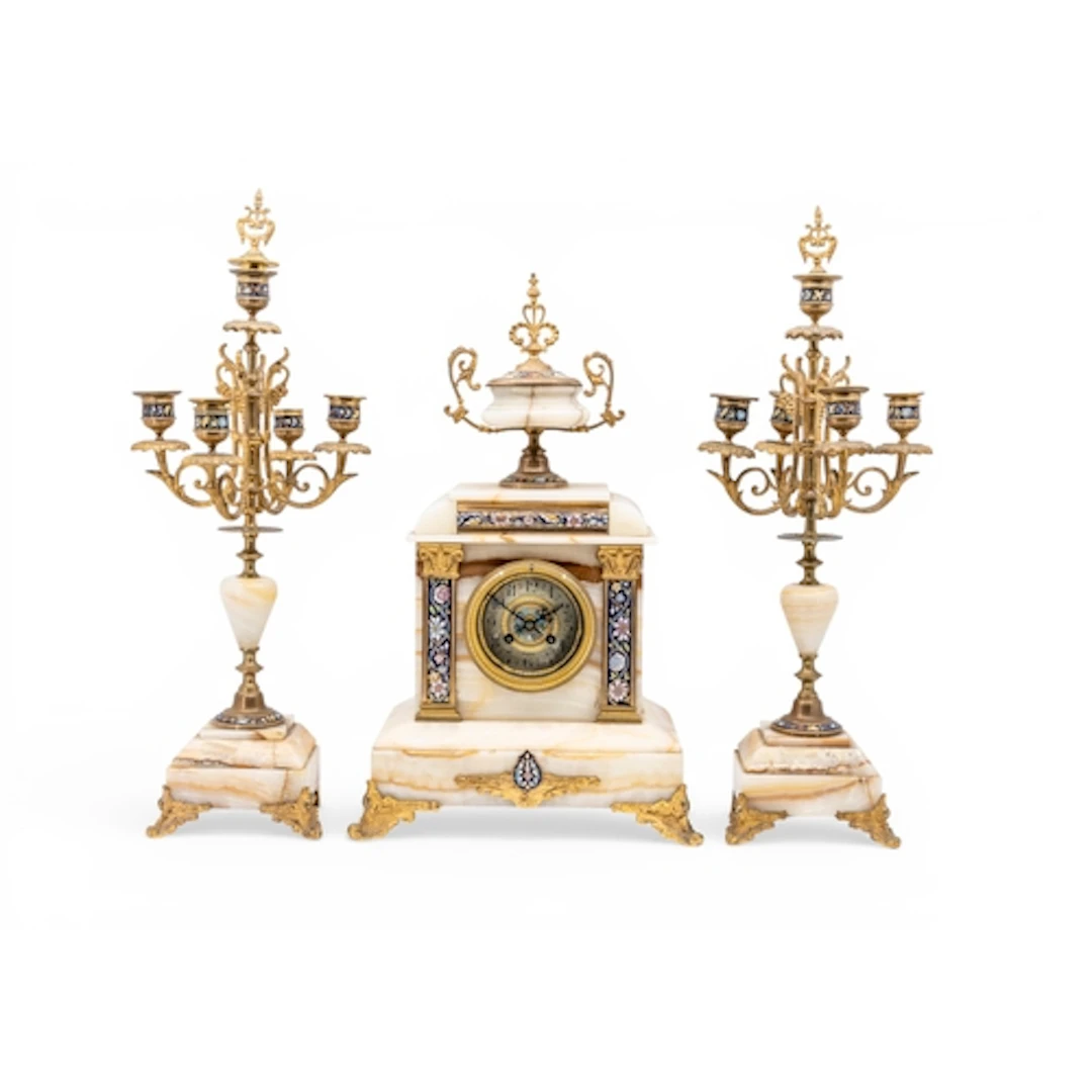 A FRENCH CHAMPLEVE AND ONYX CLOCK GARNITURE, the clock with ...