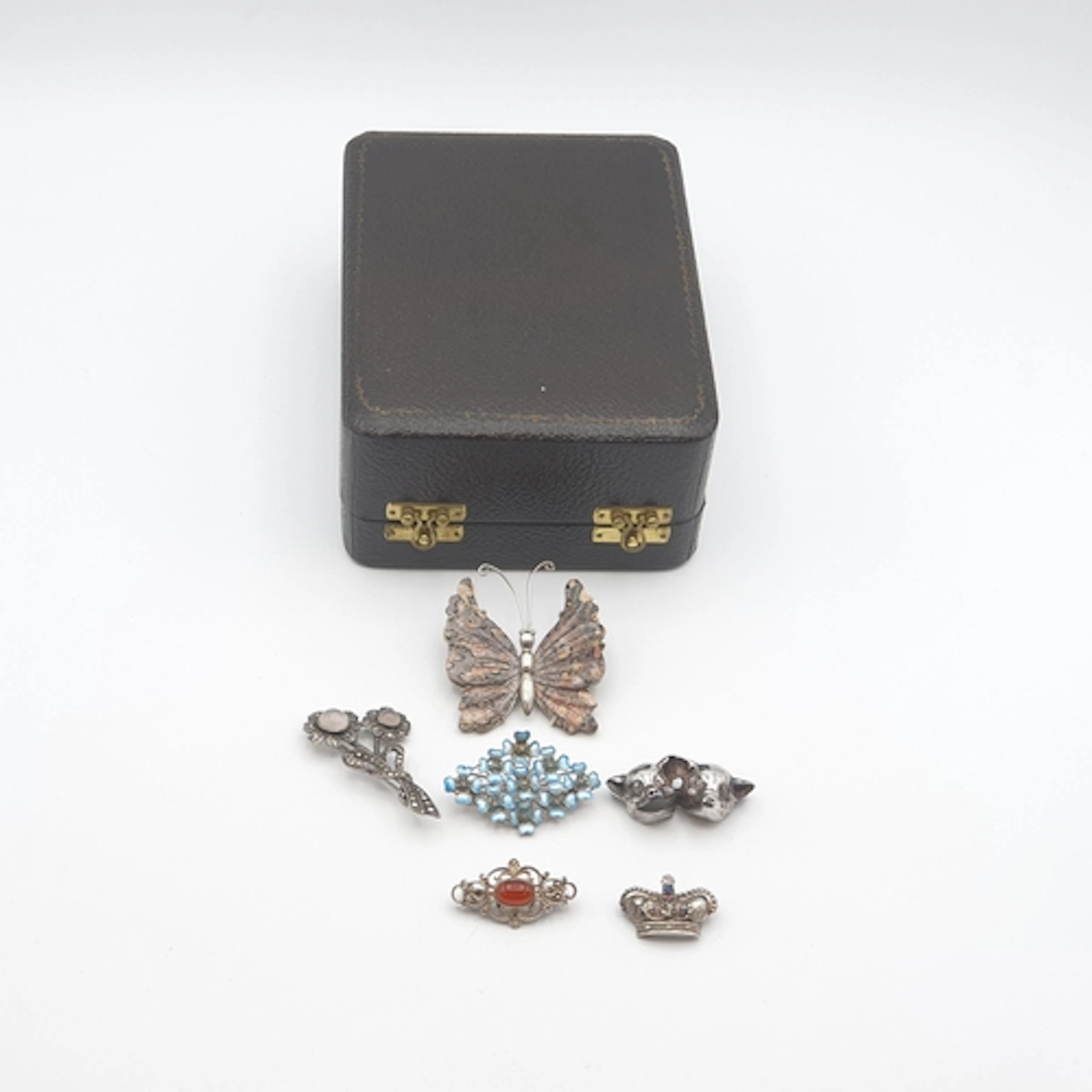 Six various silver Brooches including; double pig 'Tragedy a...