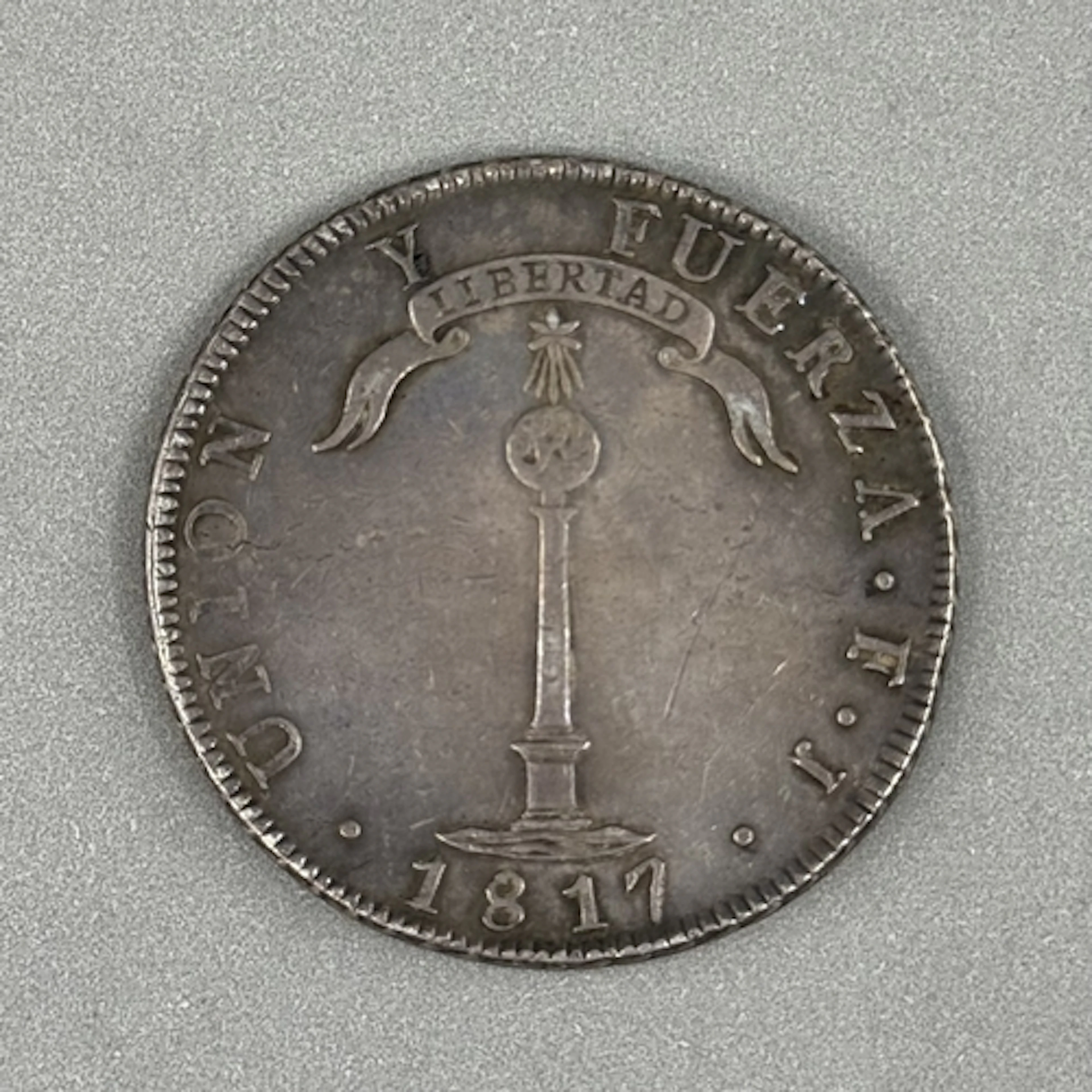 Coins: Chilean 1 Peso coin, silver, 26.8 grams.
