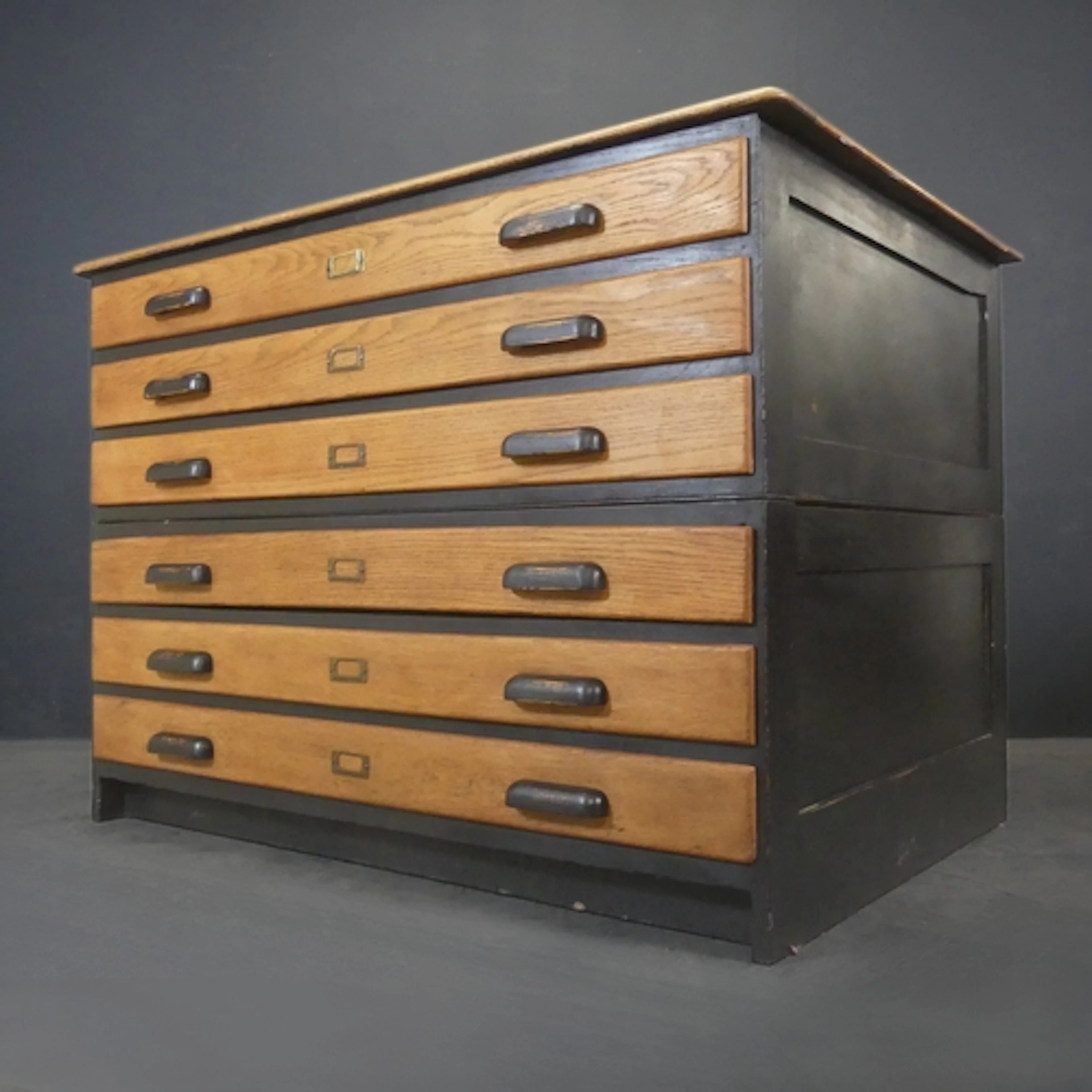 A 1930s oak two section, six drawer architect's or artist's ...