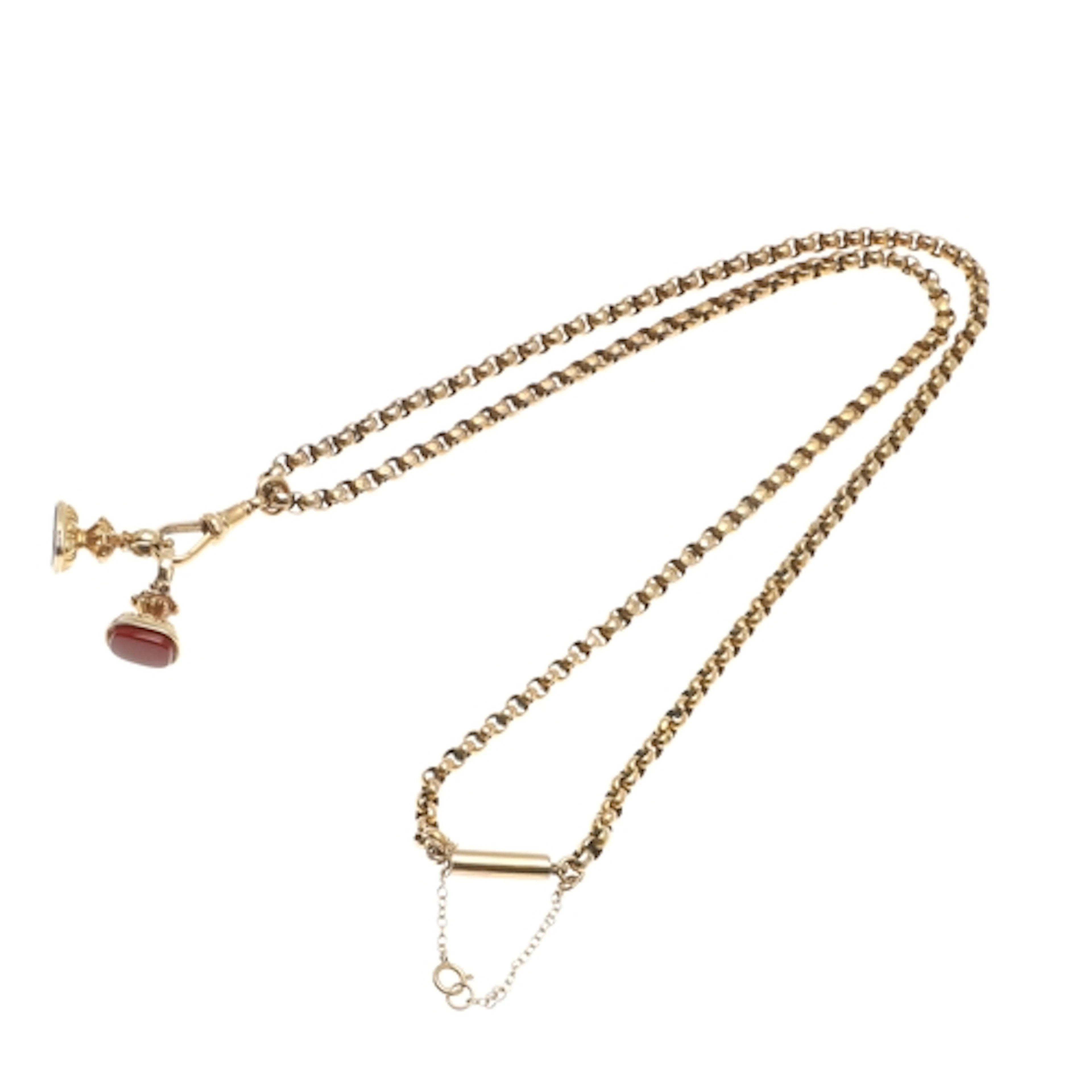 A 9CT GOLD CHAIN NECKLACE AND FOB SEALS. the chain formed wi...