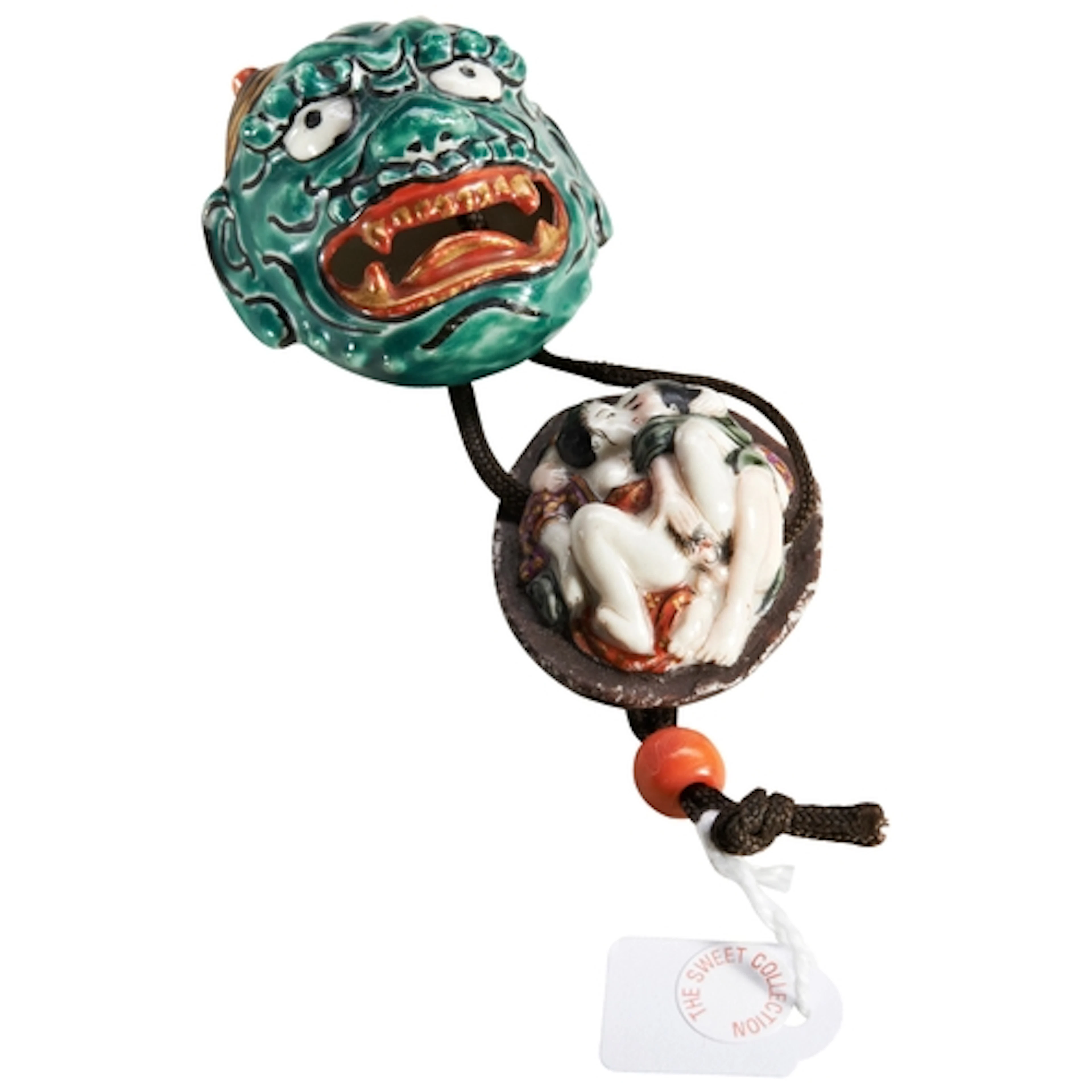 A JAPANESE PORCELAIN NETSUKE OF AN ONI MASK 19TH CENTURY the...