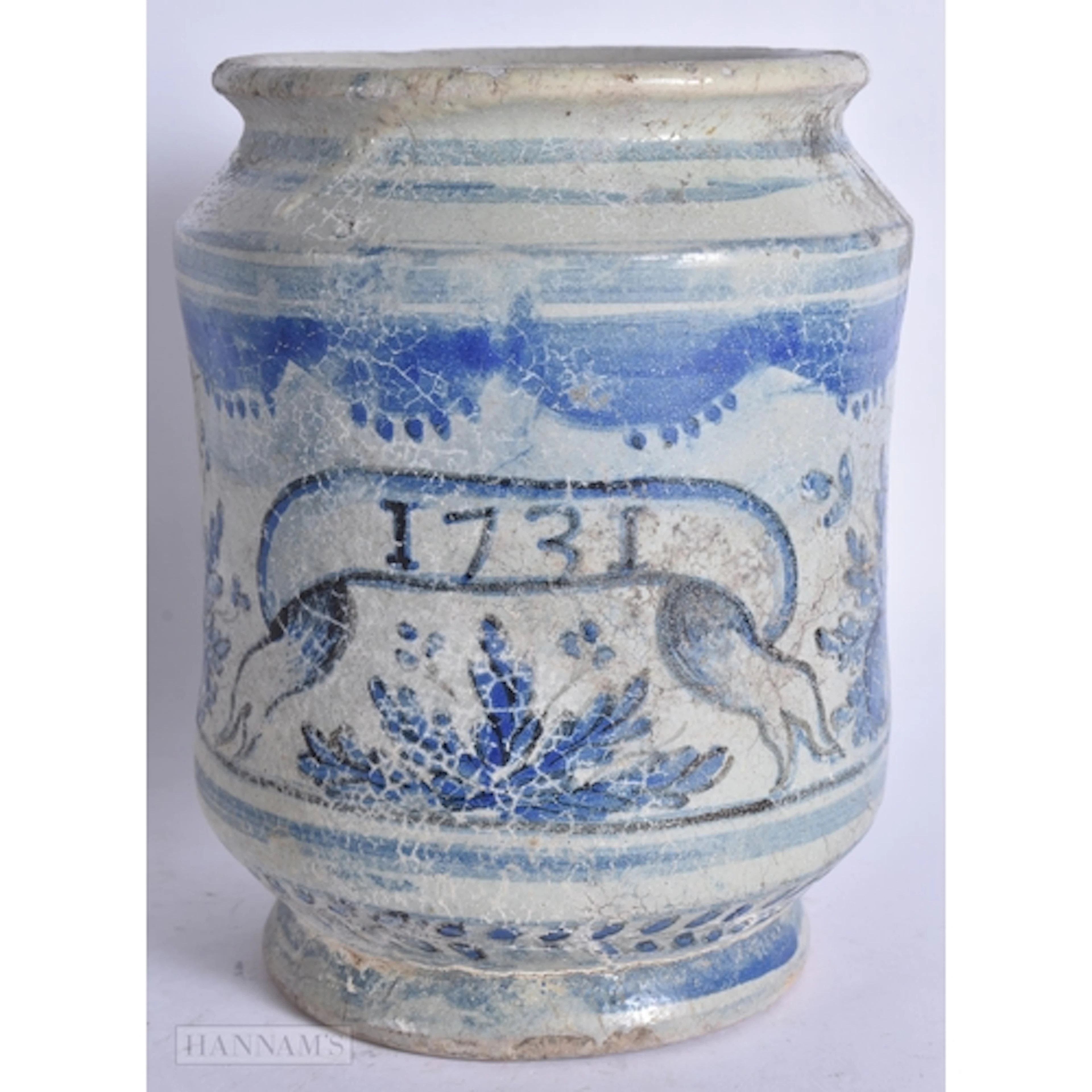 AN 18TH CENTURY ITALIAN FAIENCE ALBARELLO DRUG JAR dated 173...