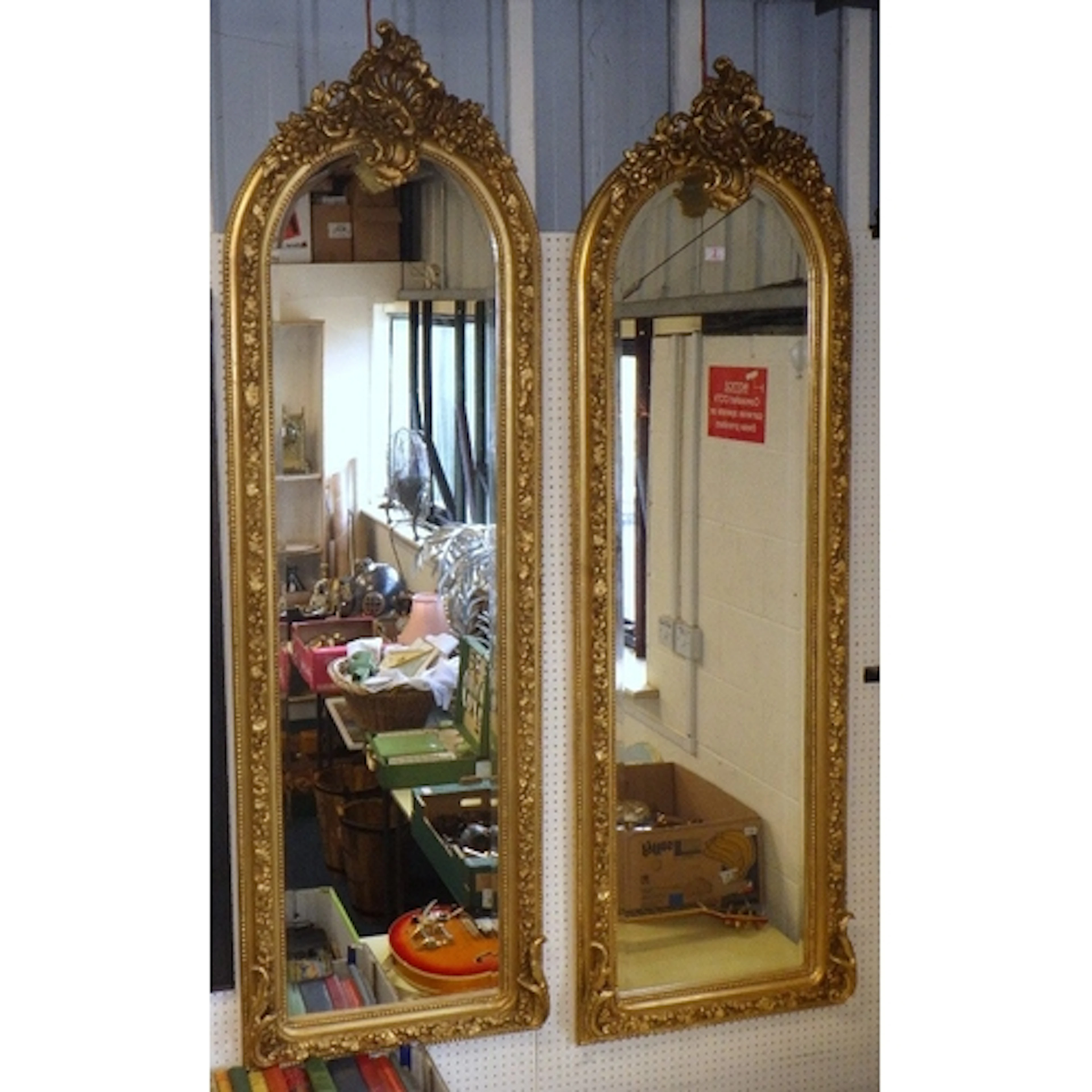 A pair of French style Gilt framed pier mirrors, of slender ...