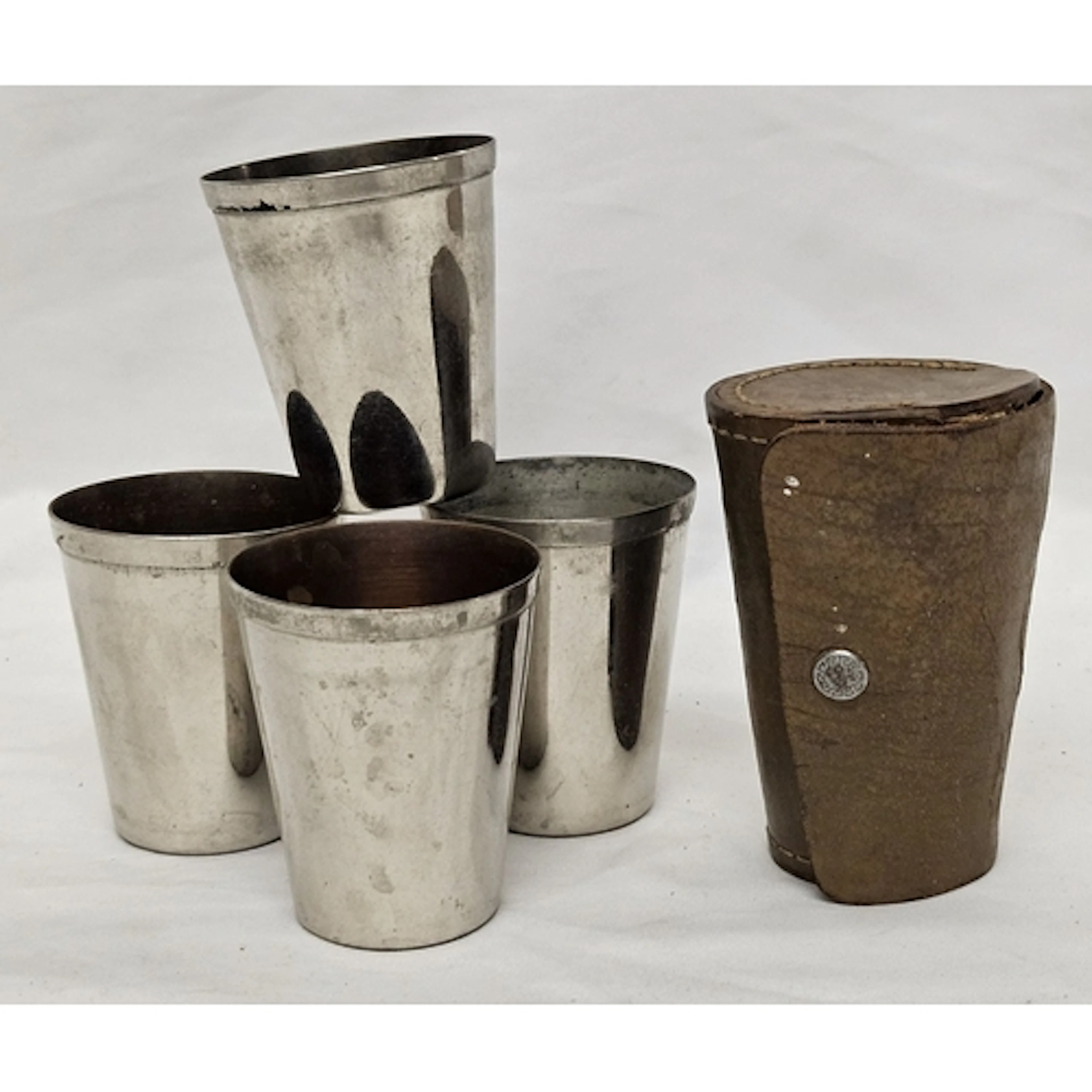 4 Metal Stirrup Cups marked Made in Canada to base in leathe...